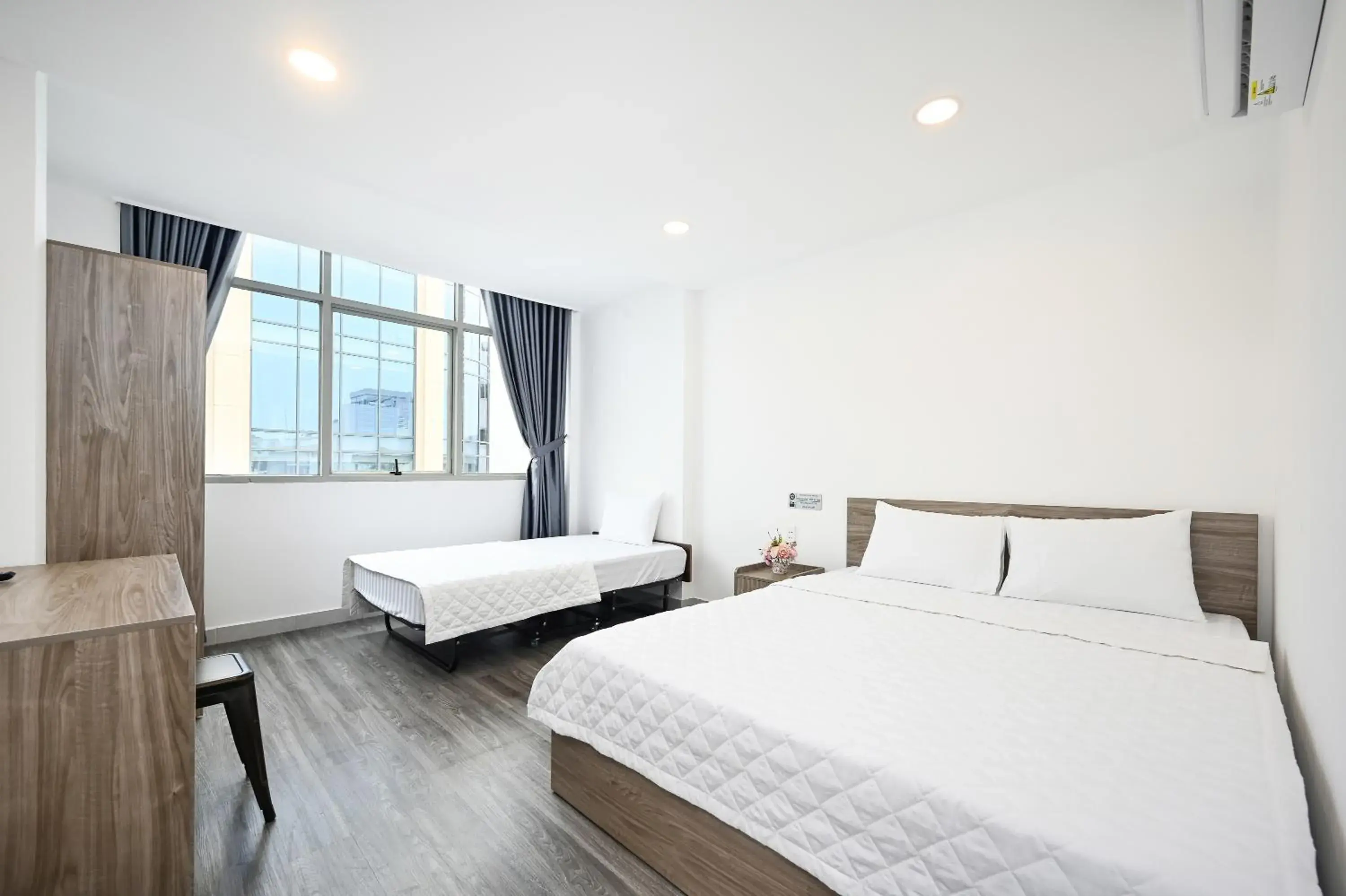 Deluxe Triple Room with City View in YoKo Airport Saigon Hotel Deluxe Triple Room with City View in YoKo Airport Saigon Hotel