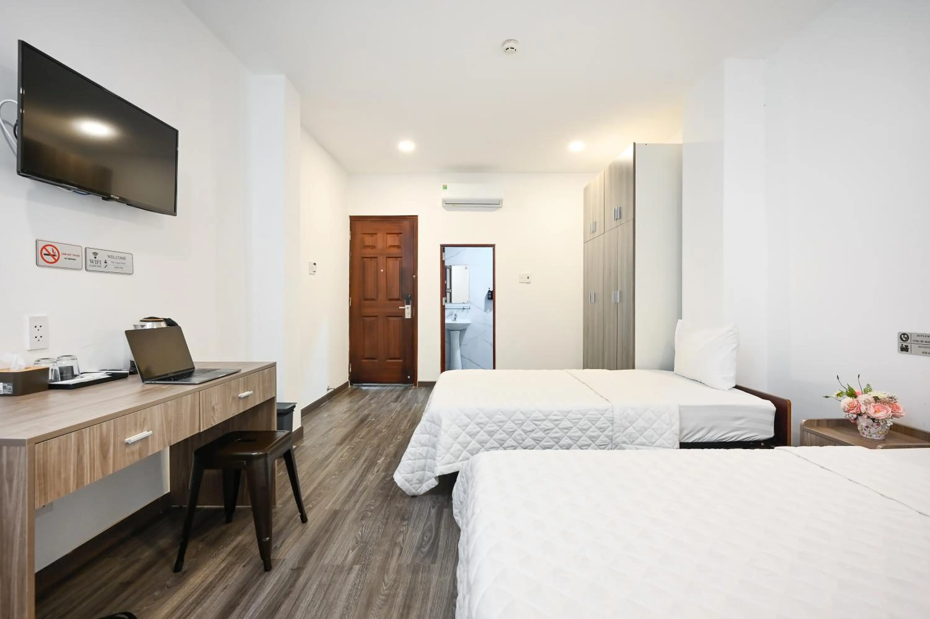 Bed in YoKo Airport Saigon Hotel