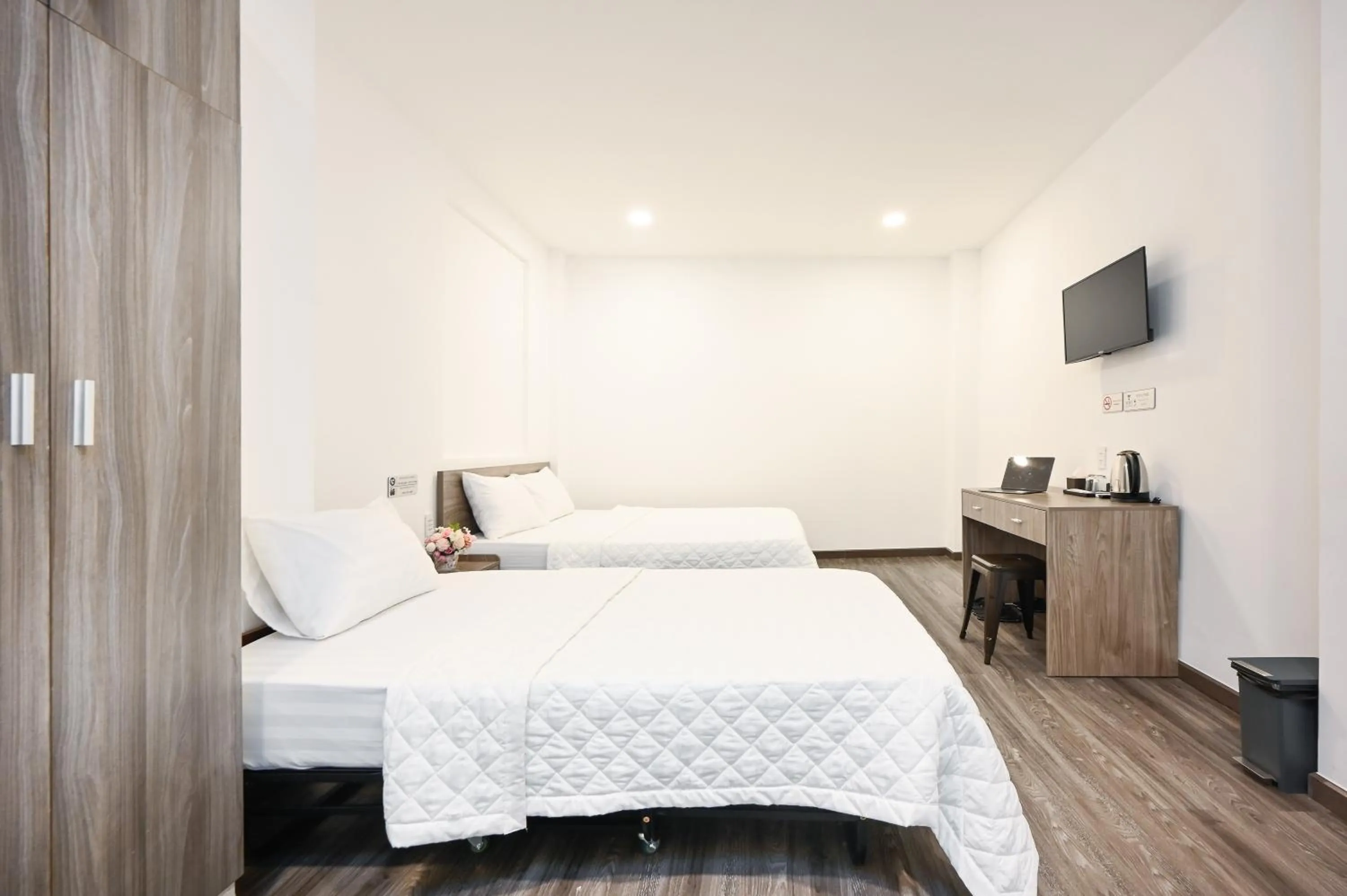 Bed in YoKo Airport Saigon Hotel