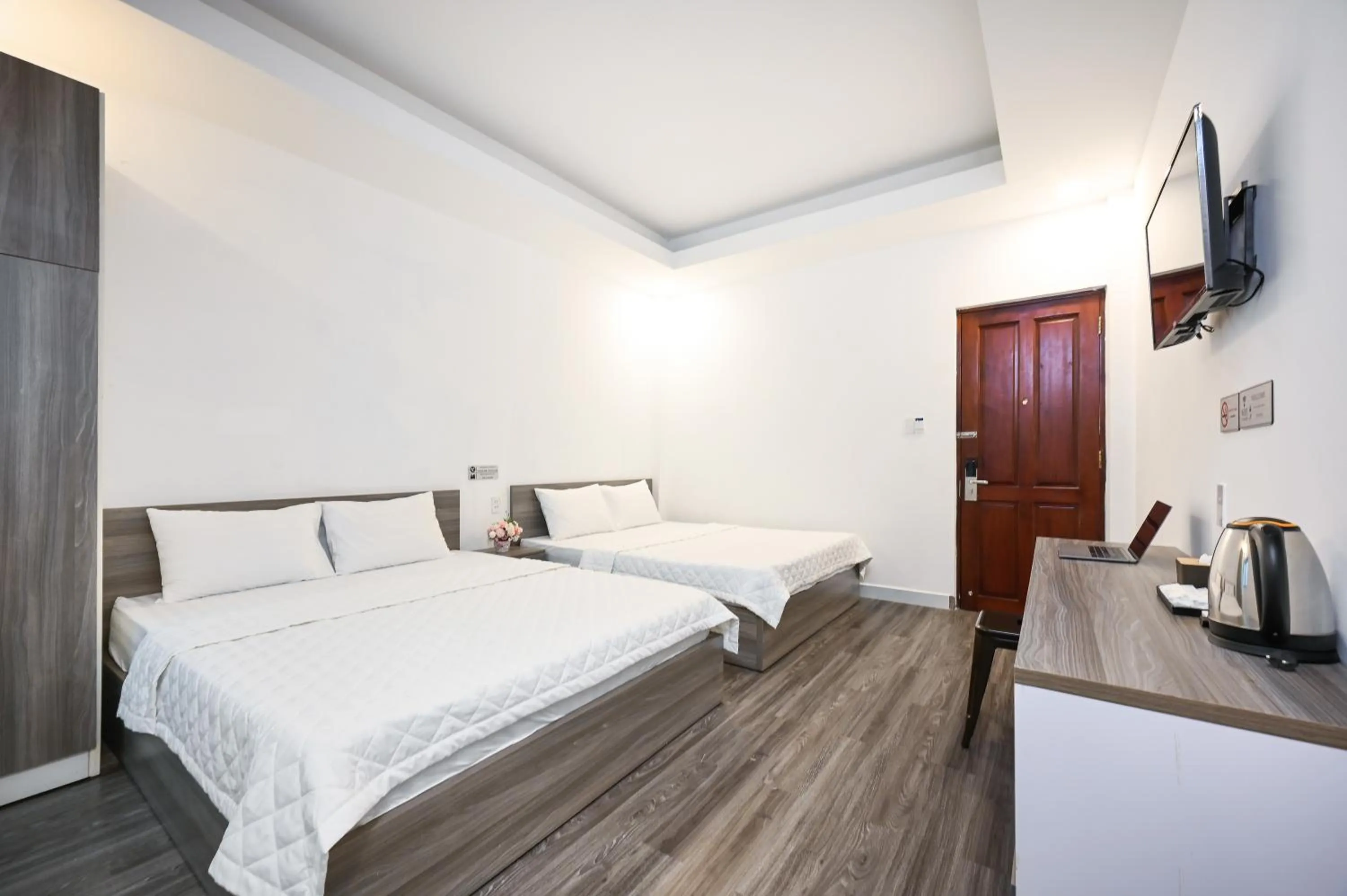 Bed in YoKo Airport Saigon Hotel