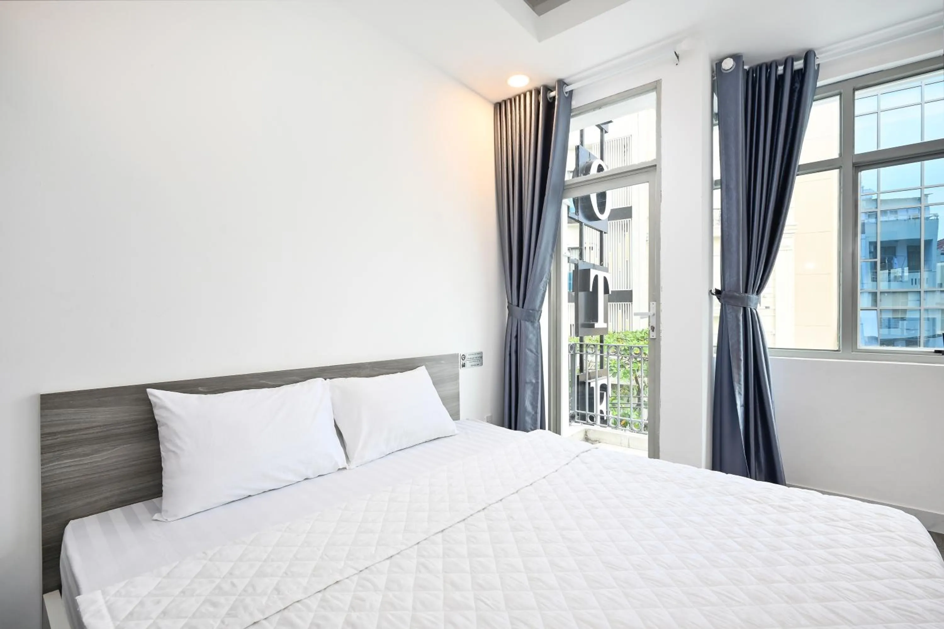 Bed in YoKo Airport Saigon Hotel