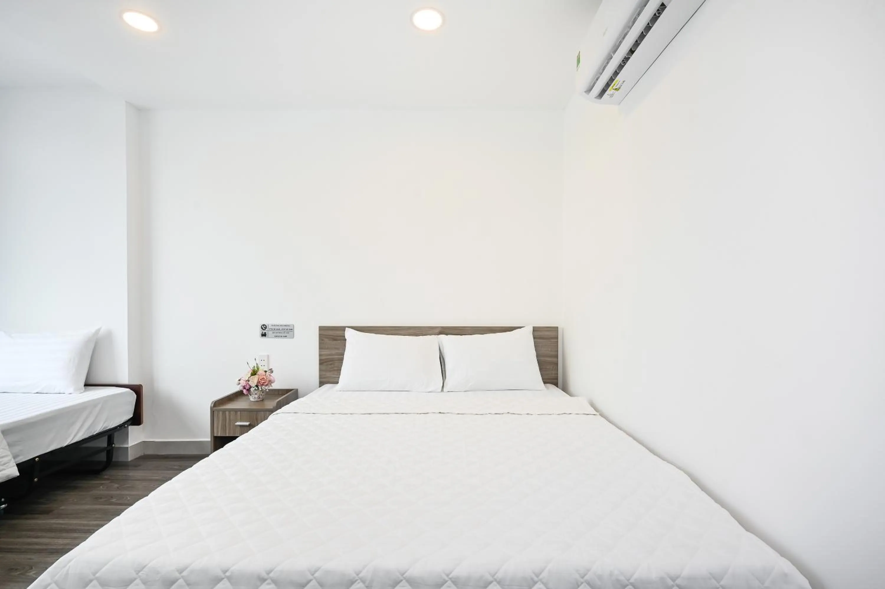 Photo of the whole room, Bed in YoKo Airport Saigon Hotel