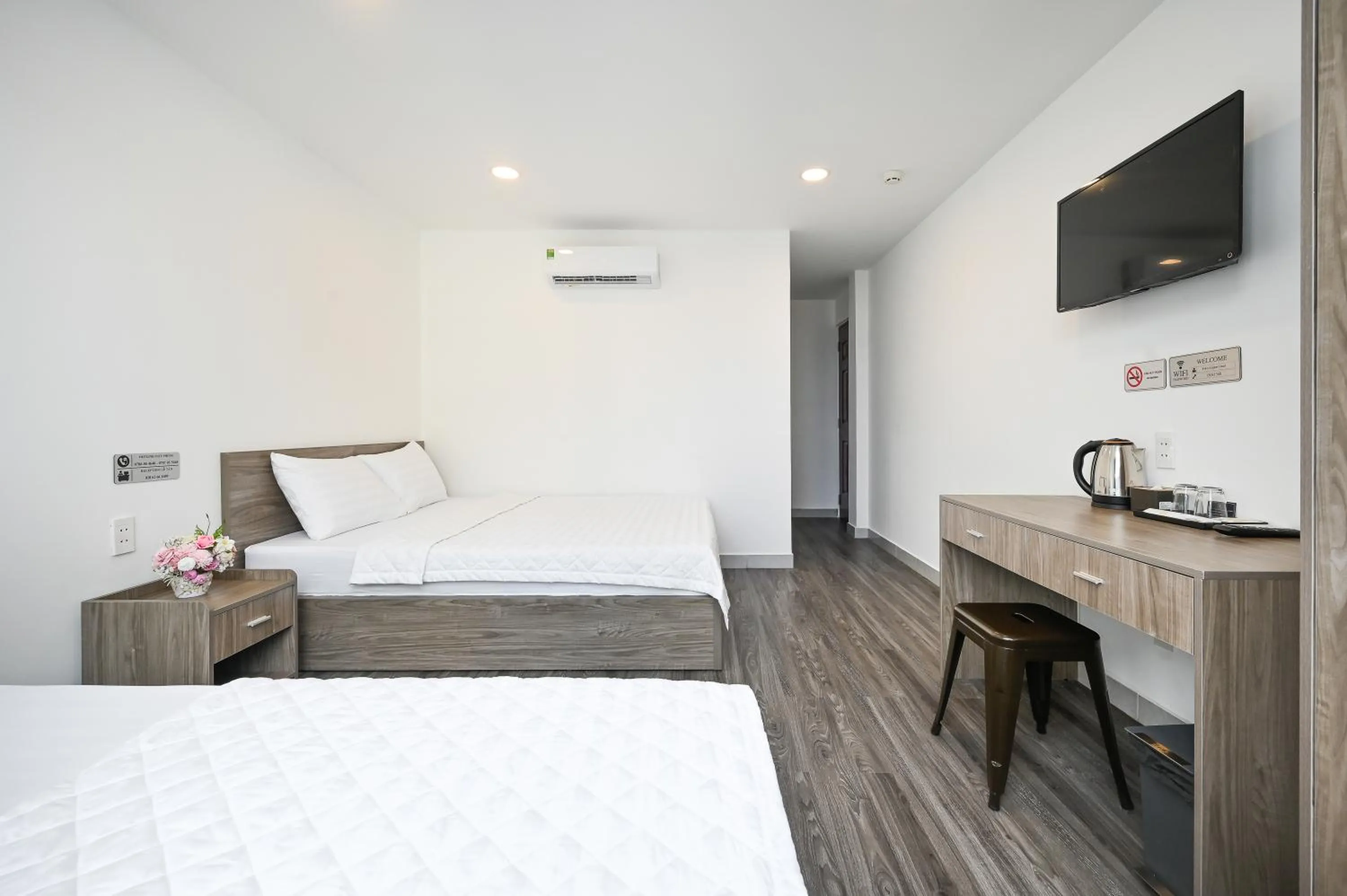 Photo of the whole room, Bed in YoKo Airport Saigon Hotel