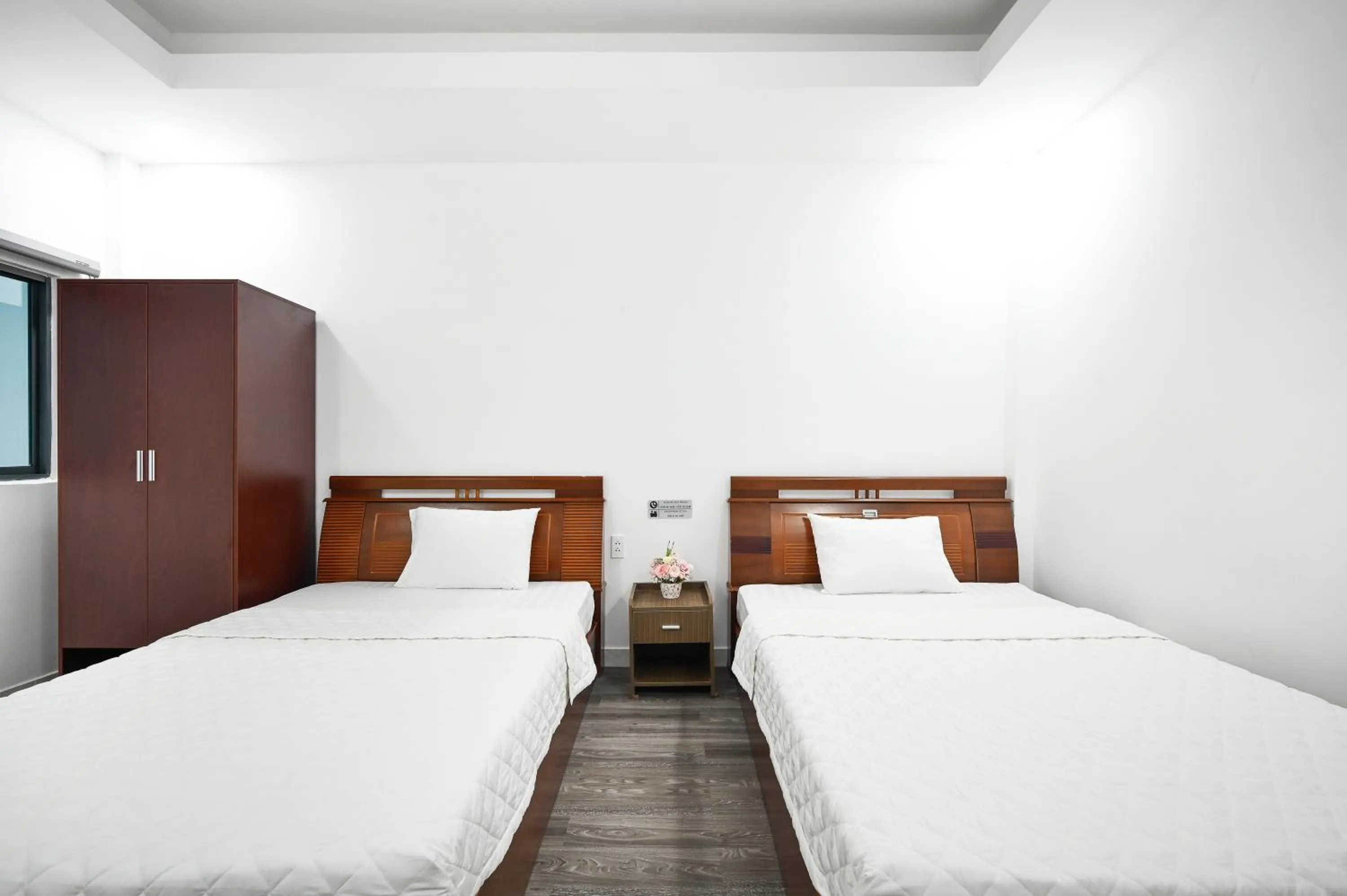 Bed in YoKo Airport Saigon Hotel