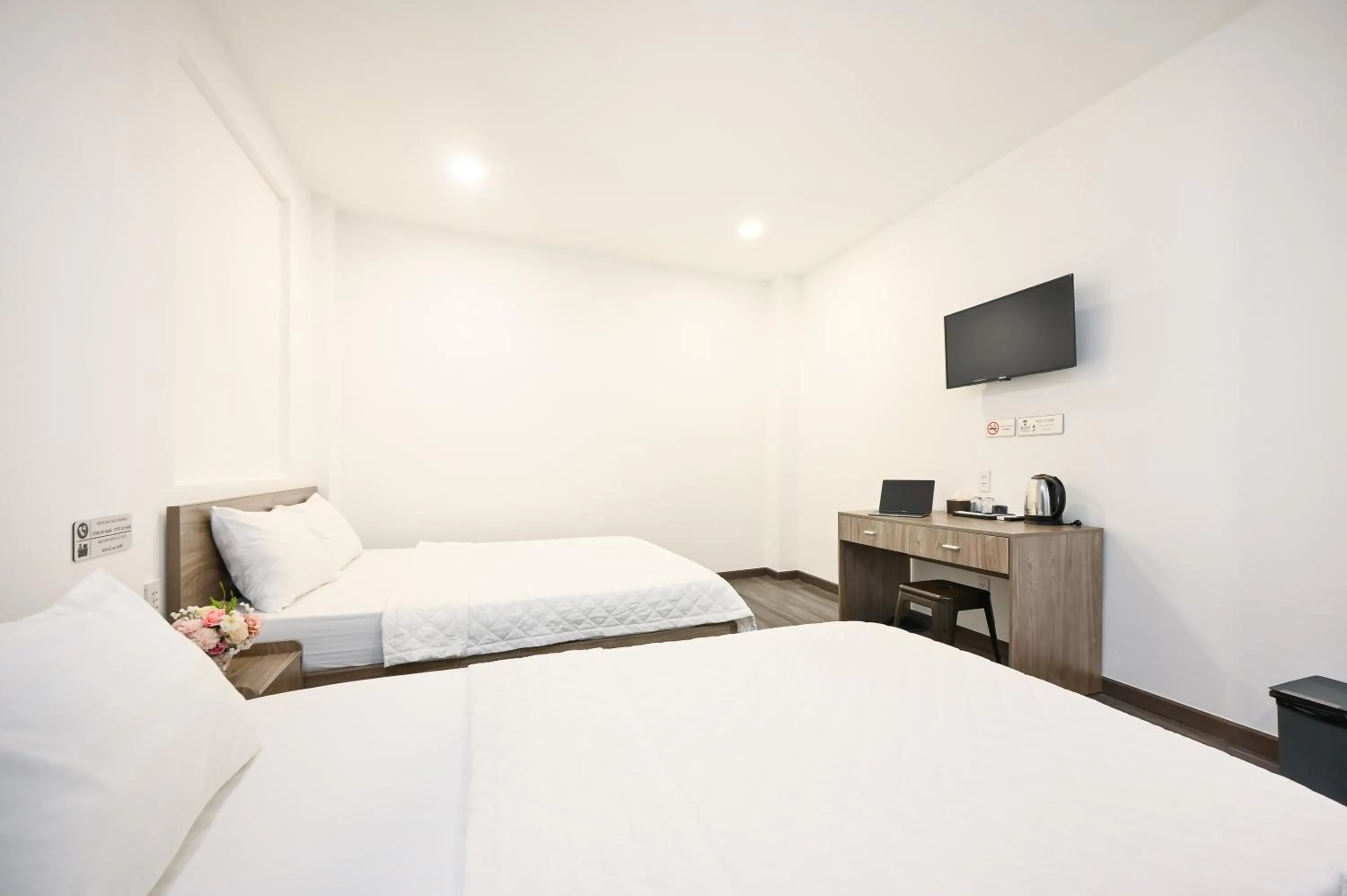 TV and multimedia, Bed in YoKo Airport Saigon Hotel