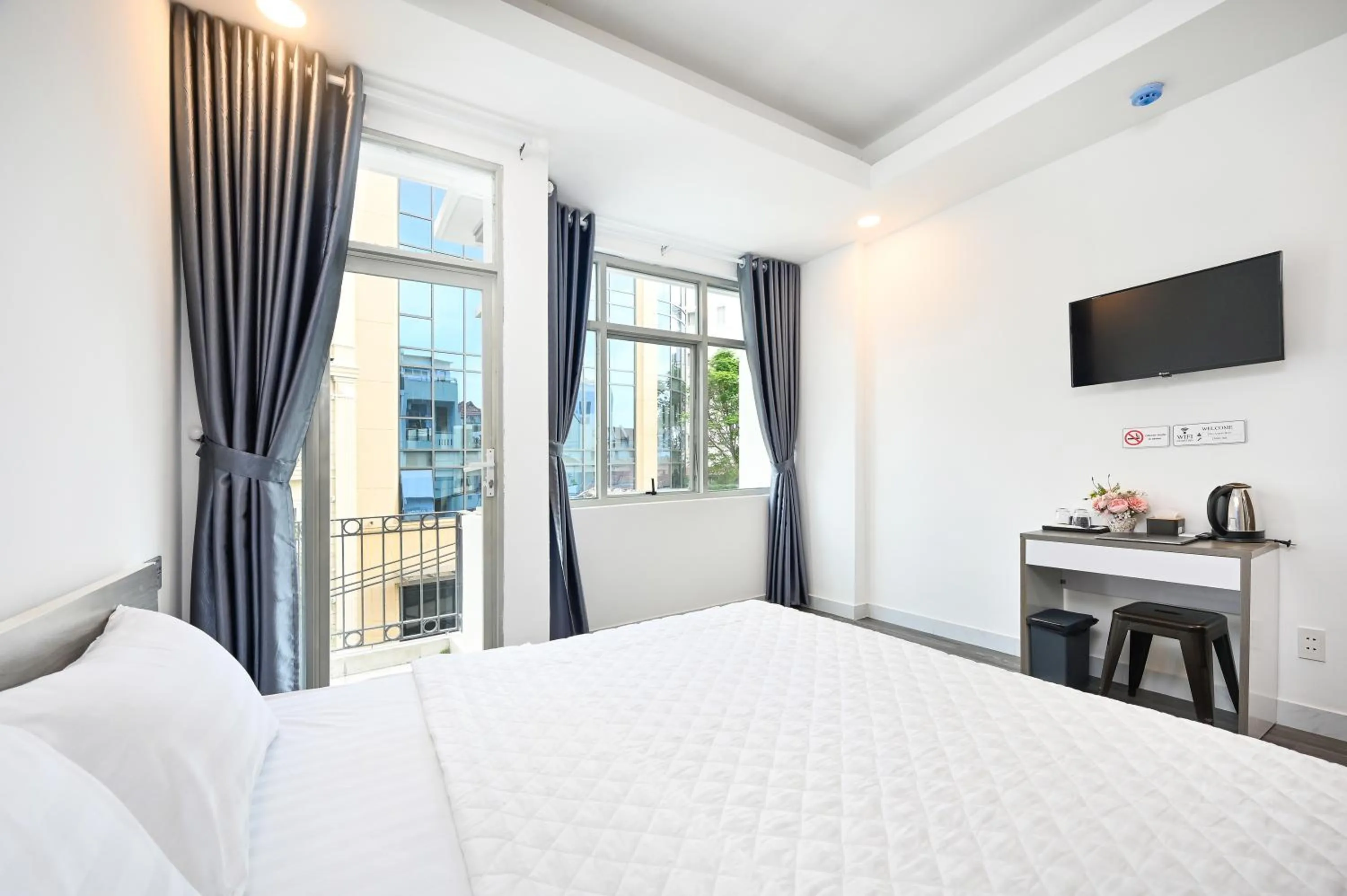 Bed in YoKo Airport Saigon Hotel