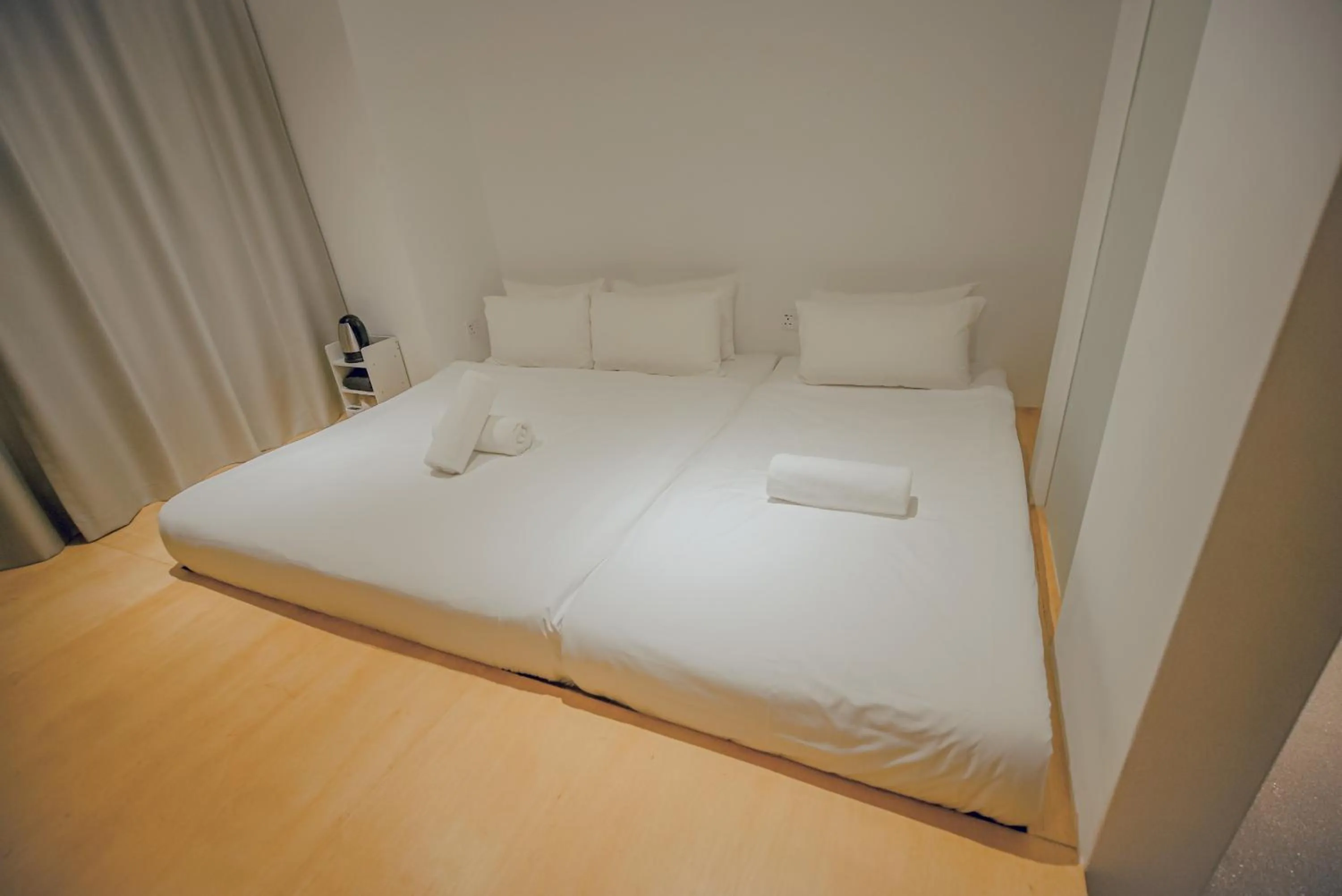 Bed in Double H Boutique Hotel