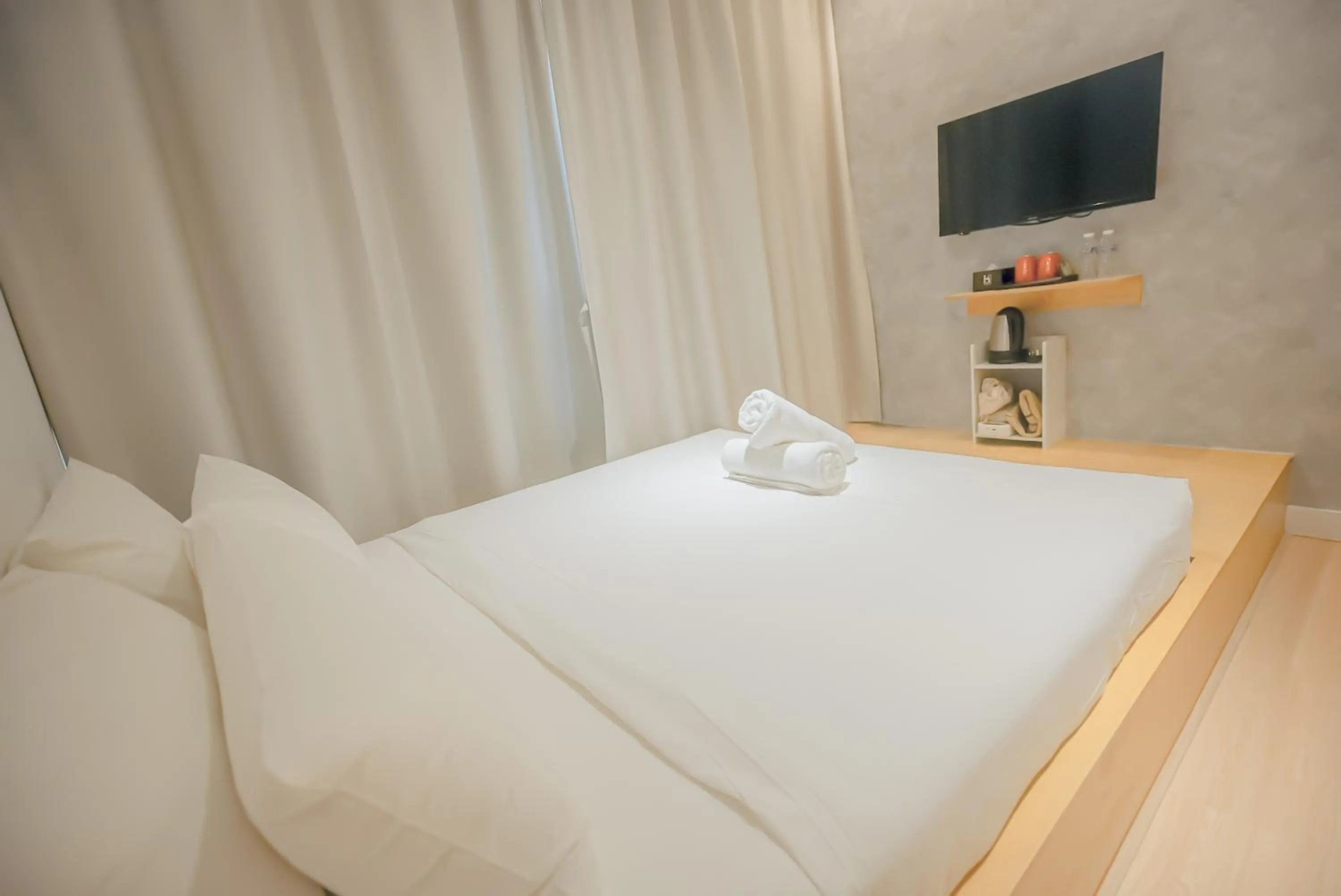 Bed in Double H Boutique Hotel