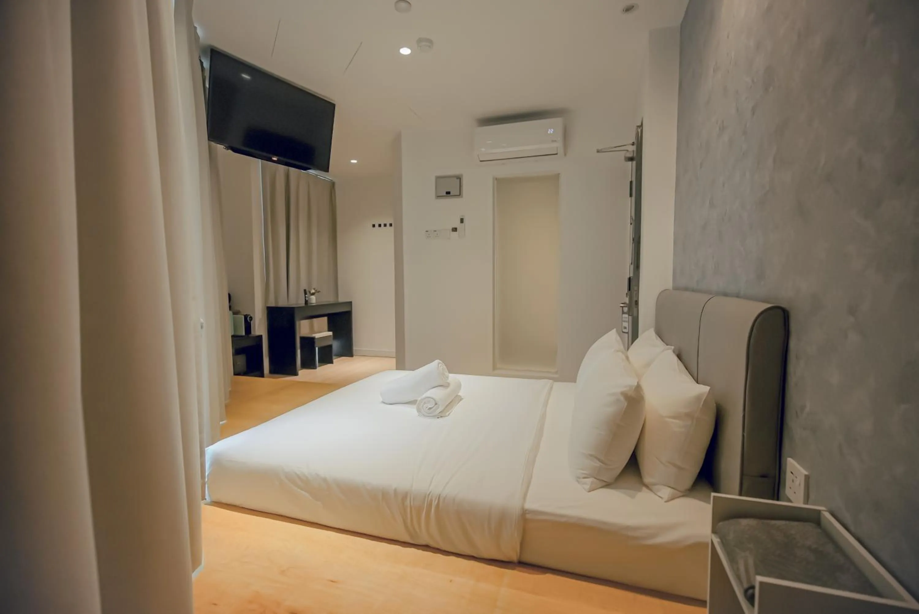 Bed in Double H Boutique Hotel