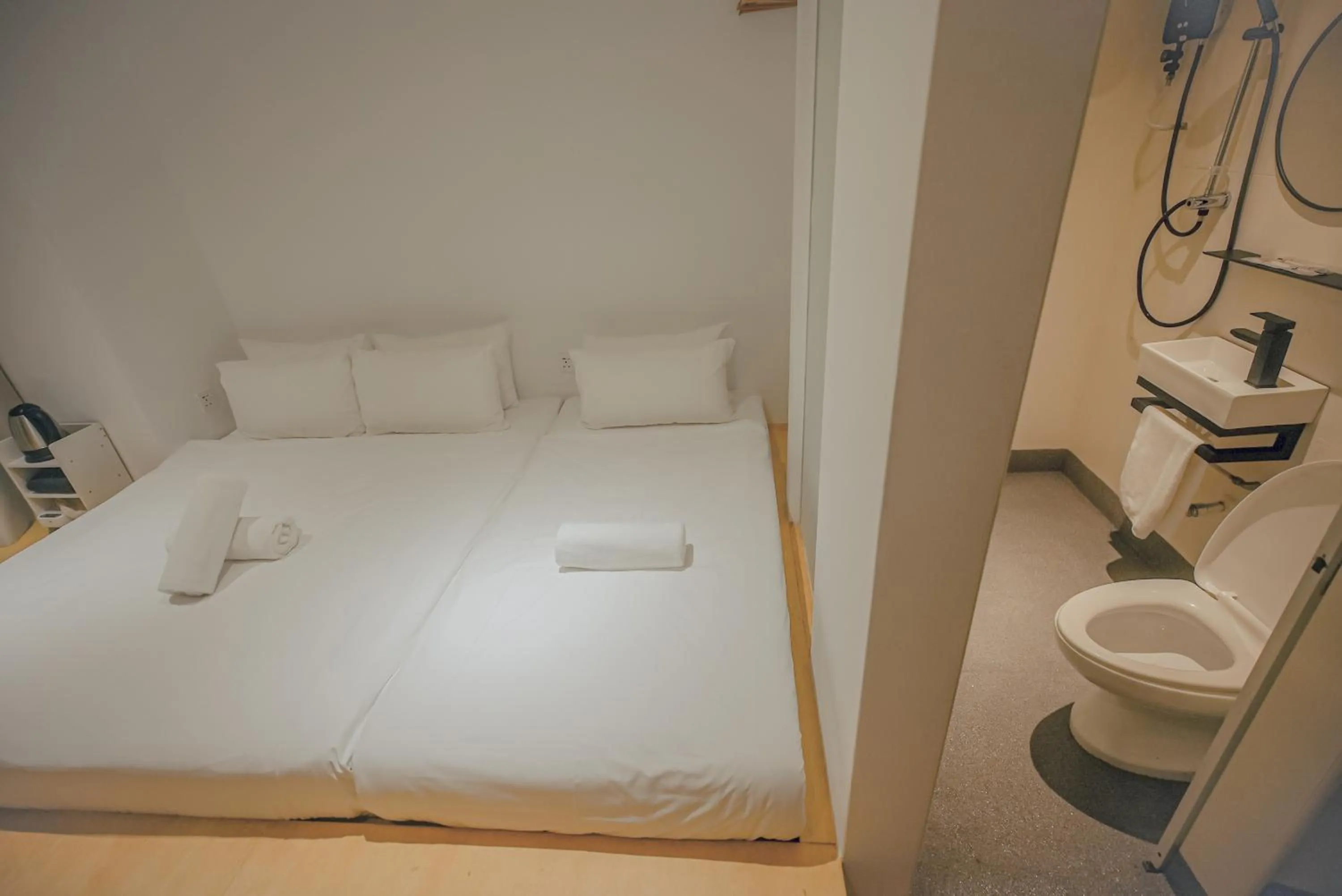 Bed in Double H Boutique Hotel