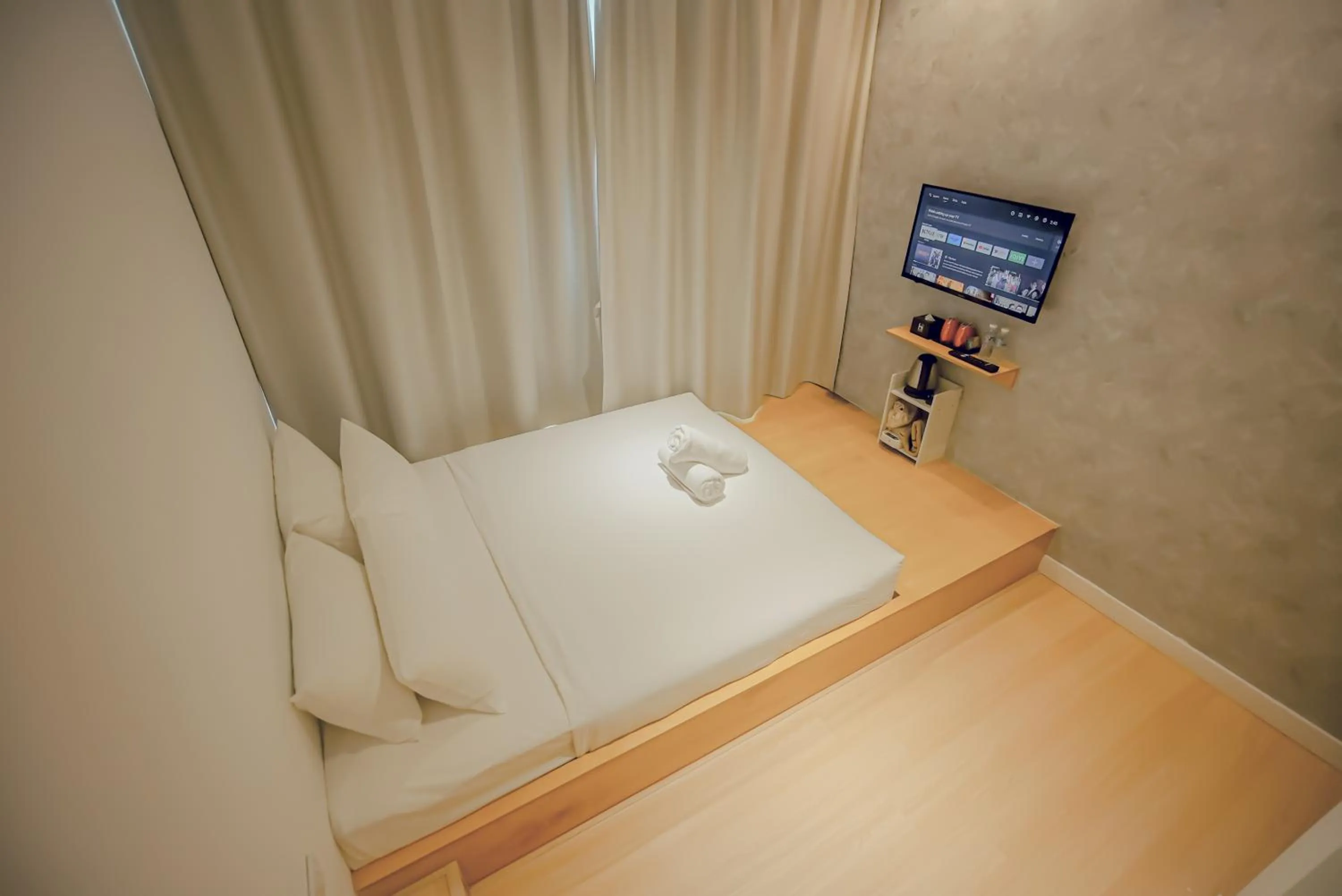 Bed in Double H Boutique Hotel