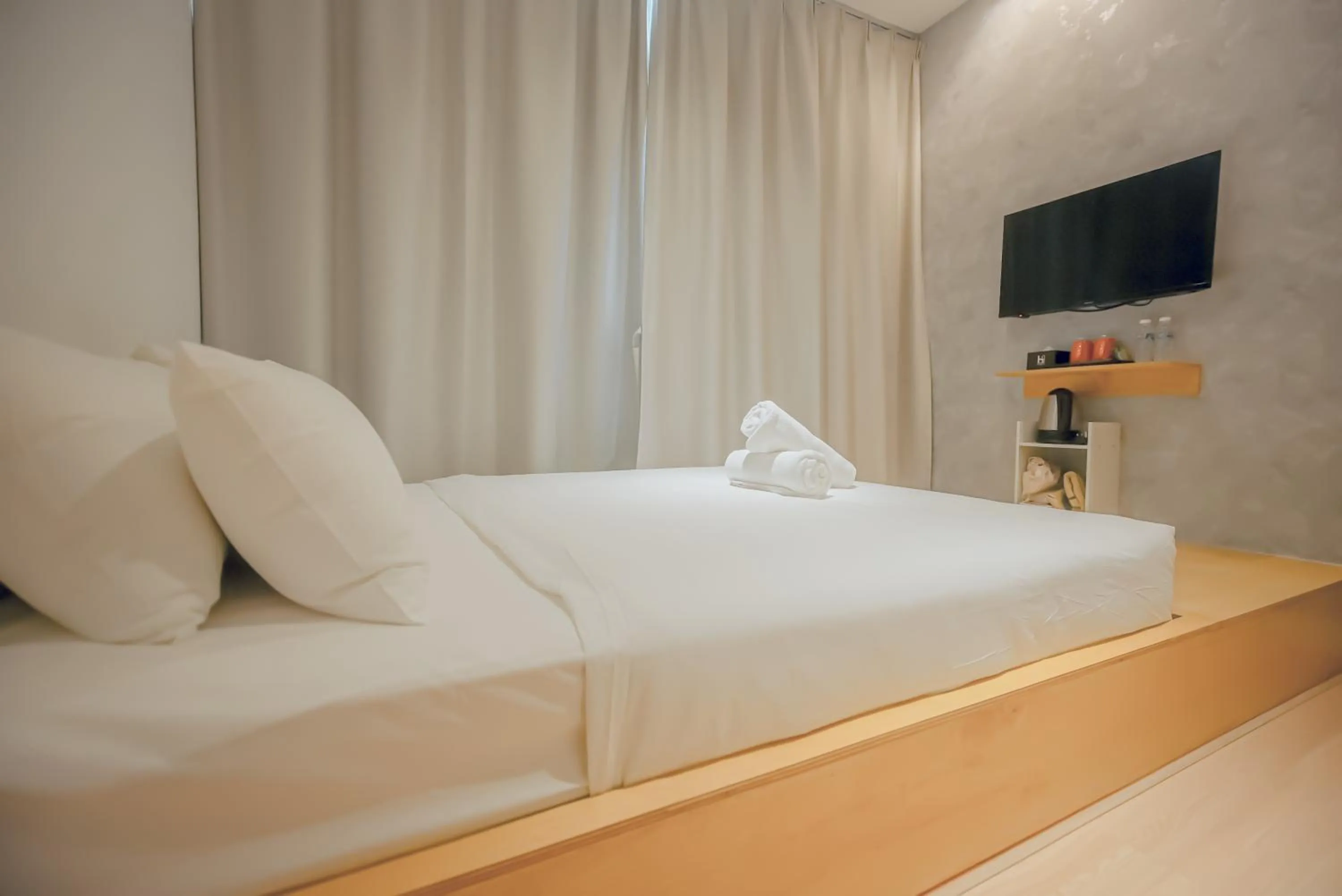 Bed in Double H Boutique Hotel