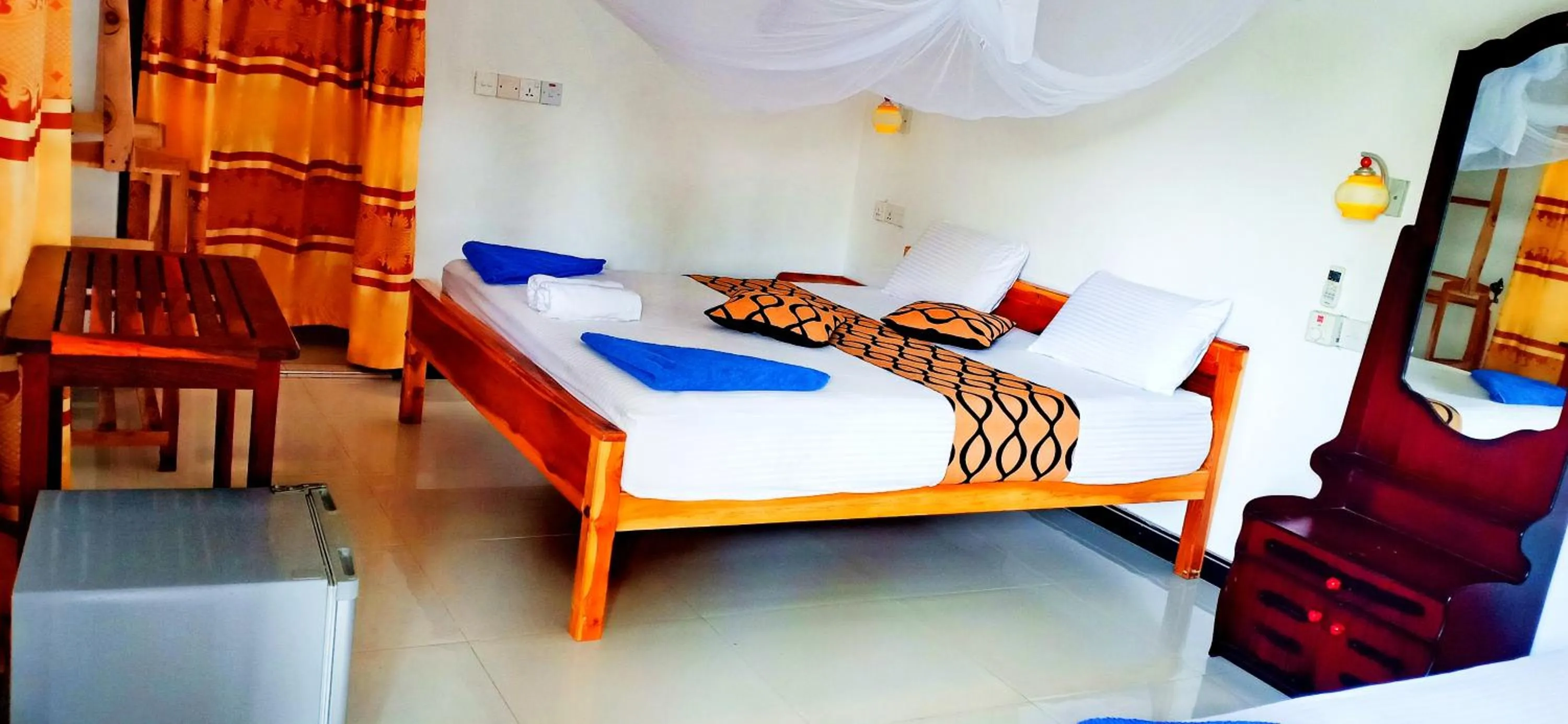 Bed in SURF & SAND Hotel Arugambay