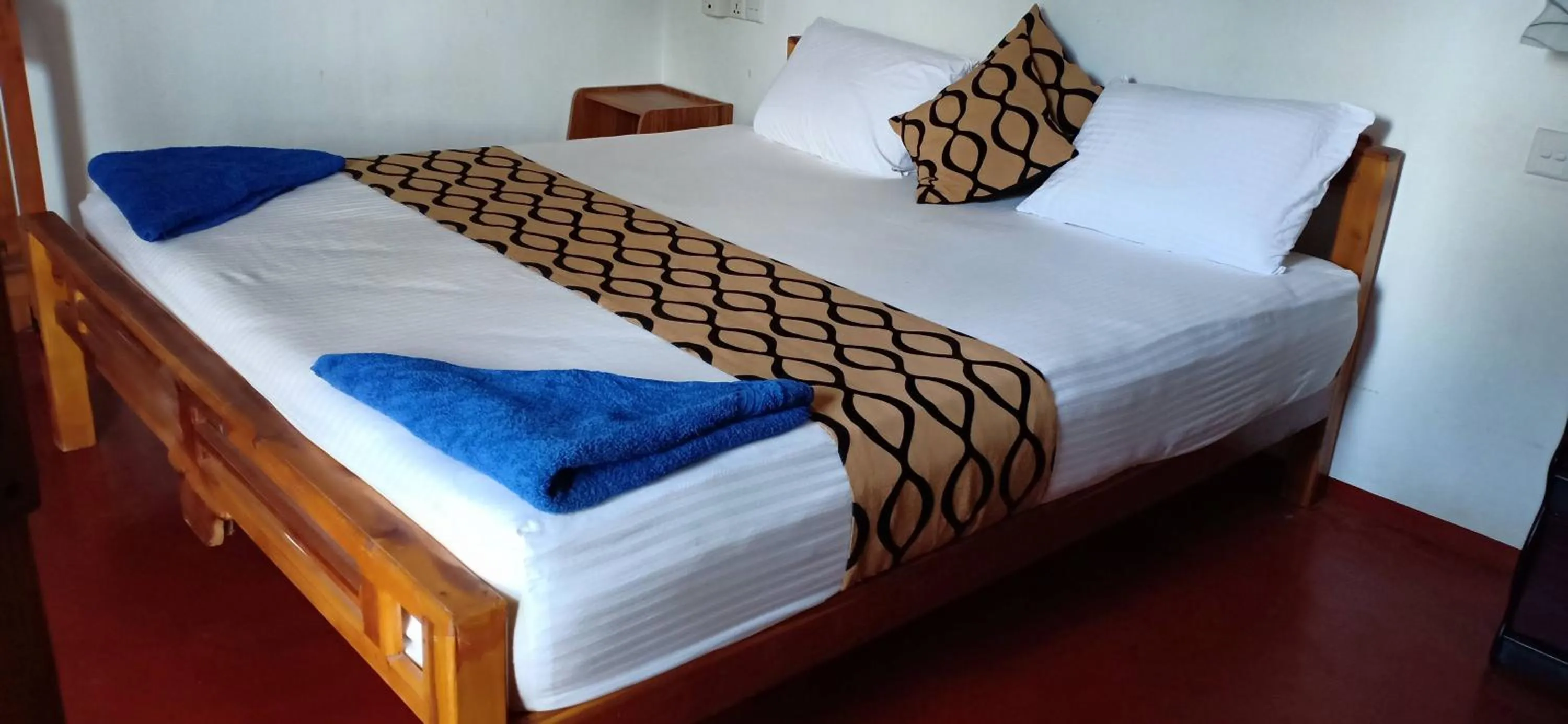 Bed in SURF & SAND Hotel Arugambay