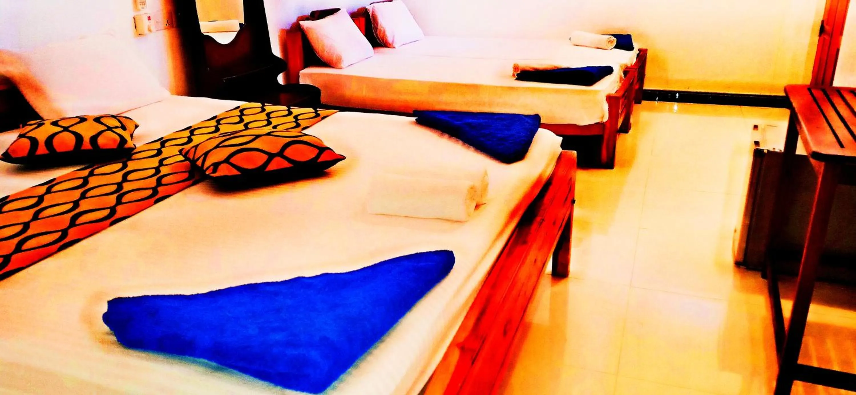 Bed in SURF & SAND Hotel Arugambay
