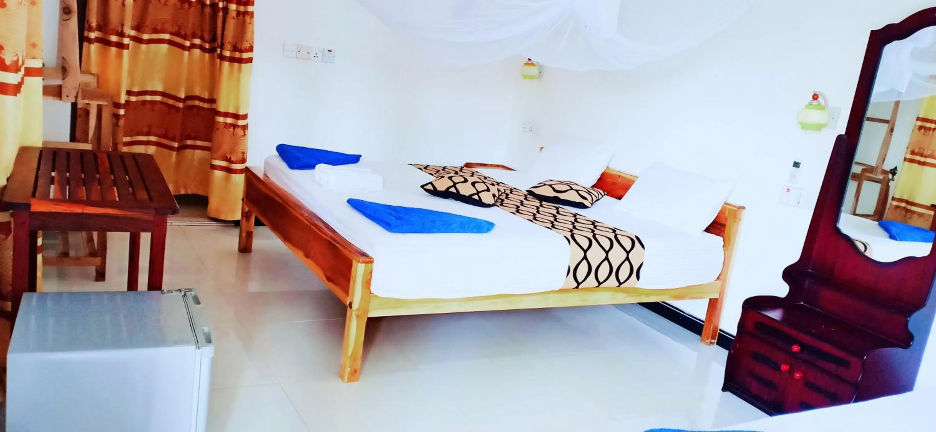 Bed in SURF & SAND Hotel Arugambay