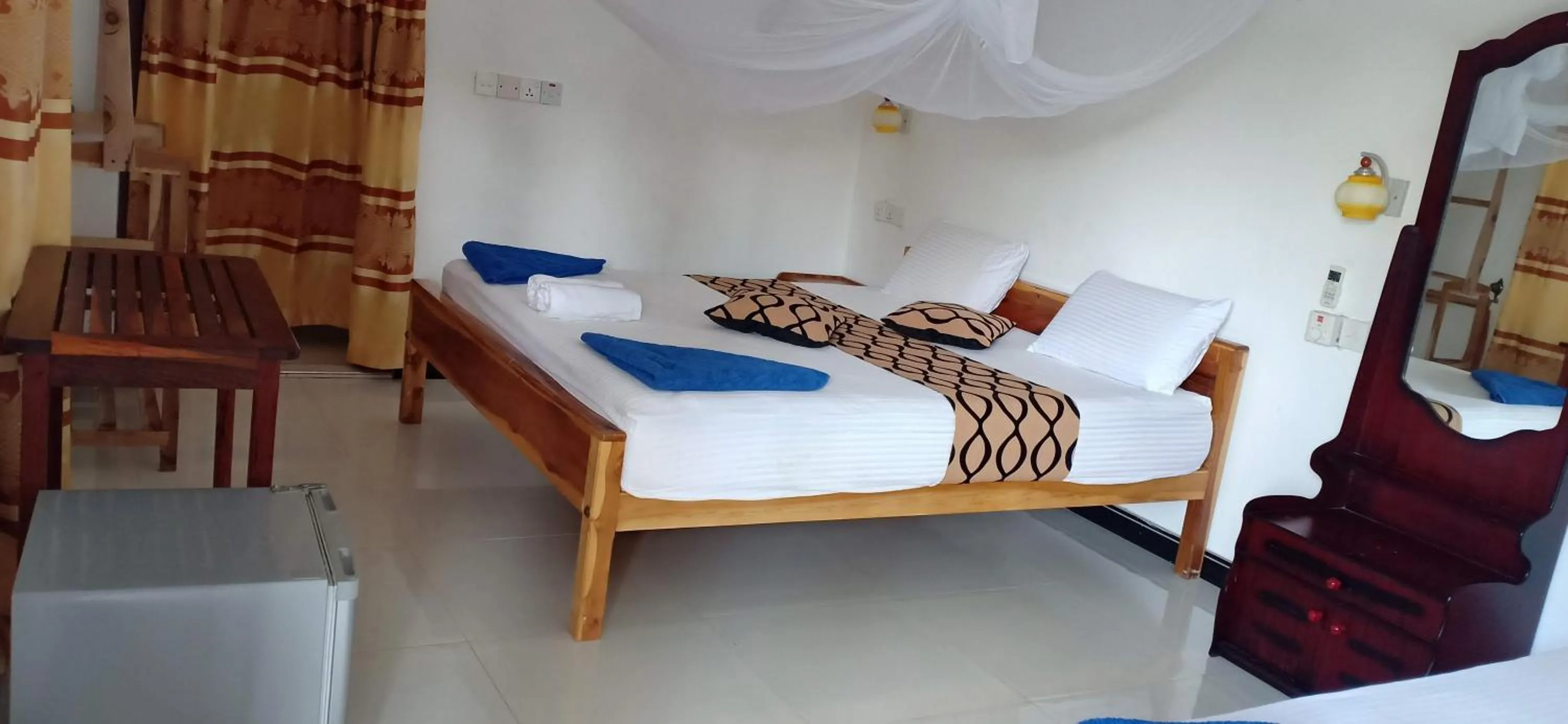 Bed in SURF & SAND Hotel Arugambay