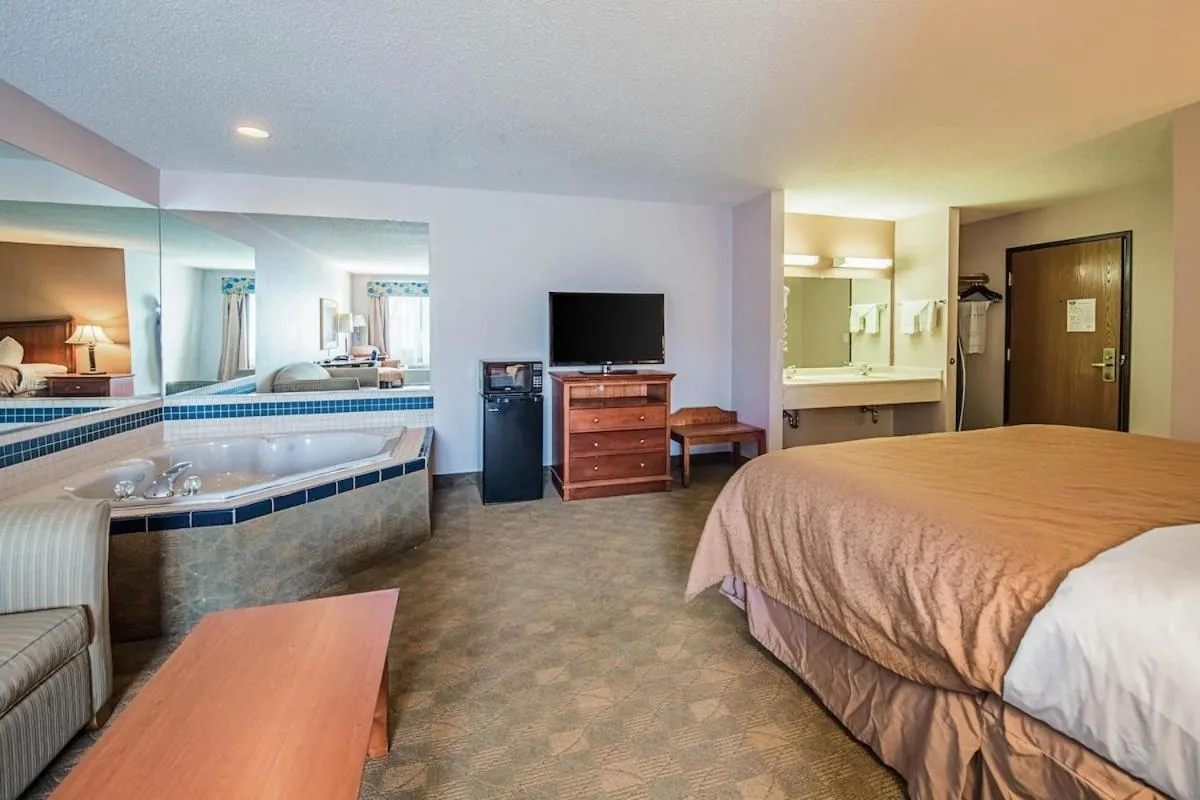 Bed in Royal Inn Suites