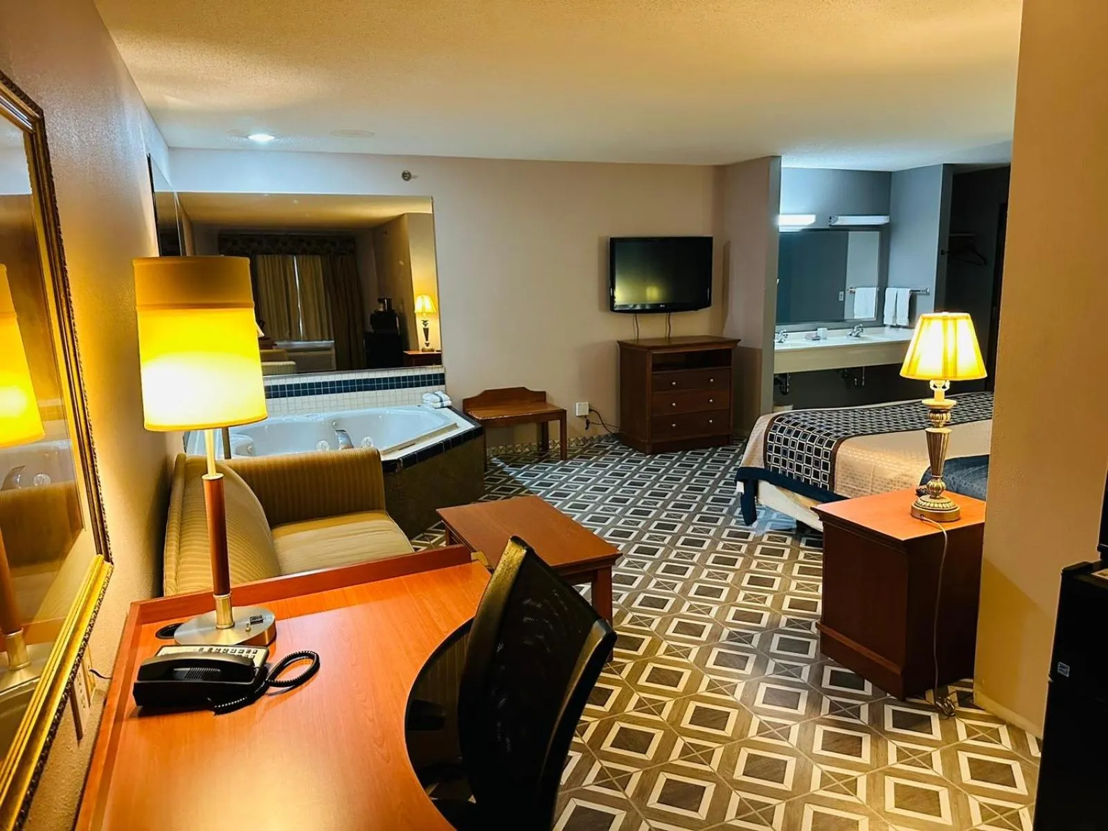 Bed in Royal Inn Suites