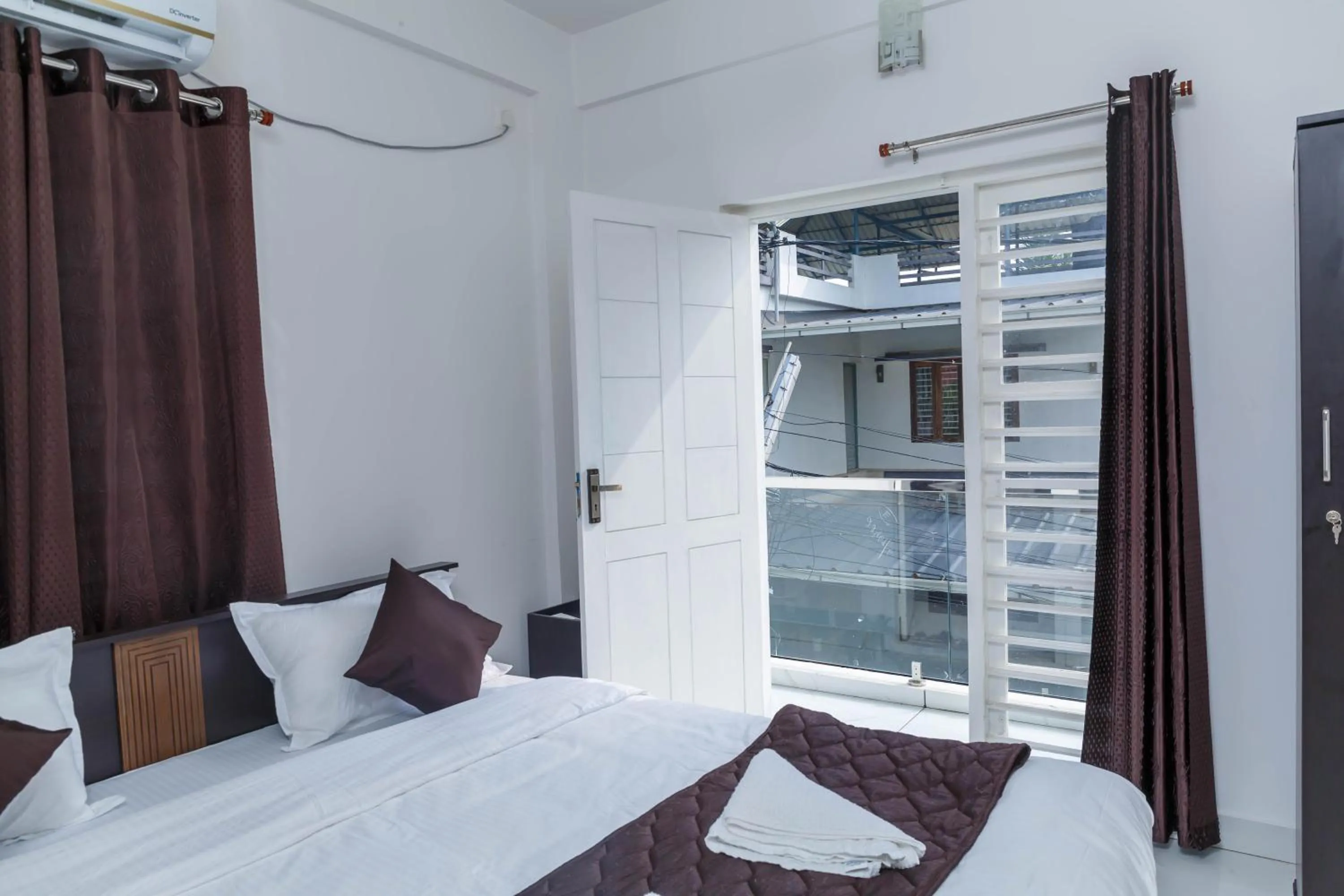 Bed in Guest West Inn Cochin