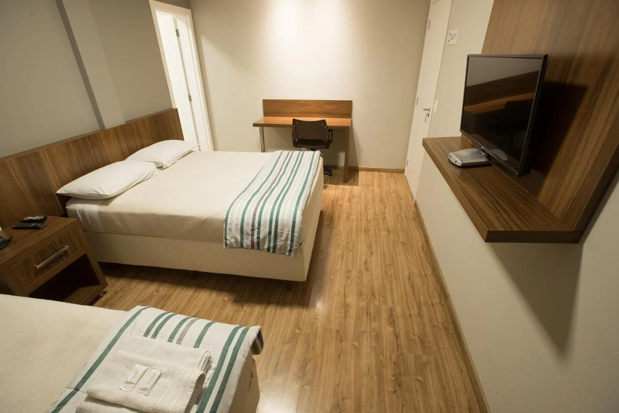 Bed in Ipê Hotel Express