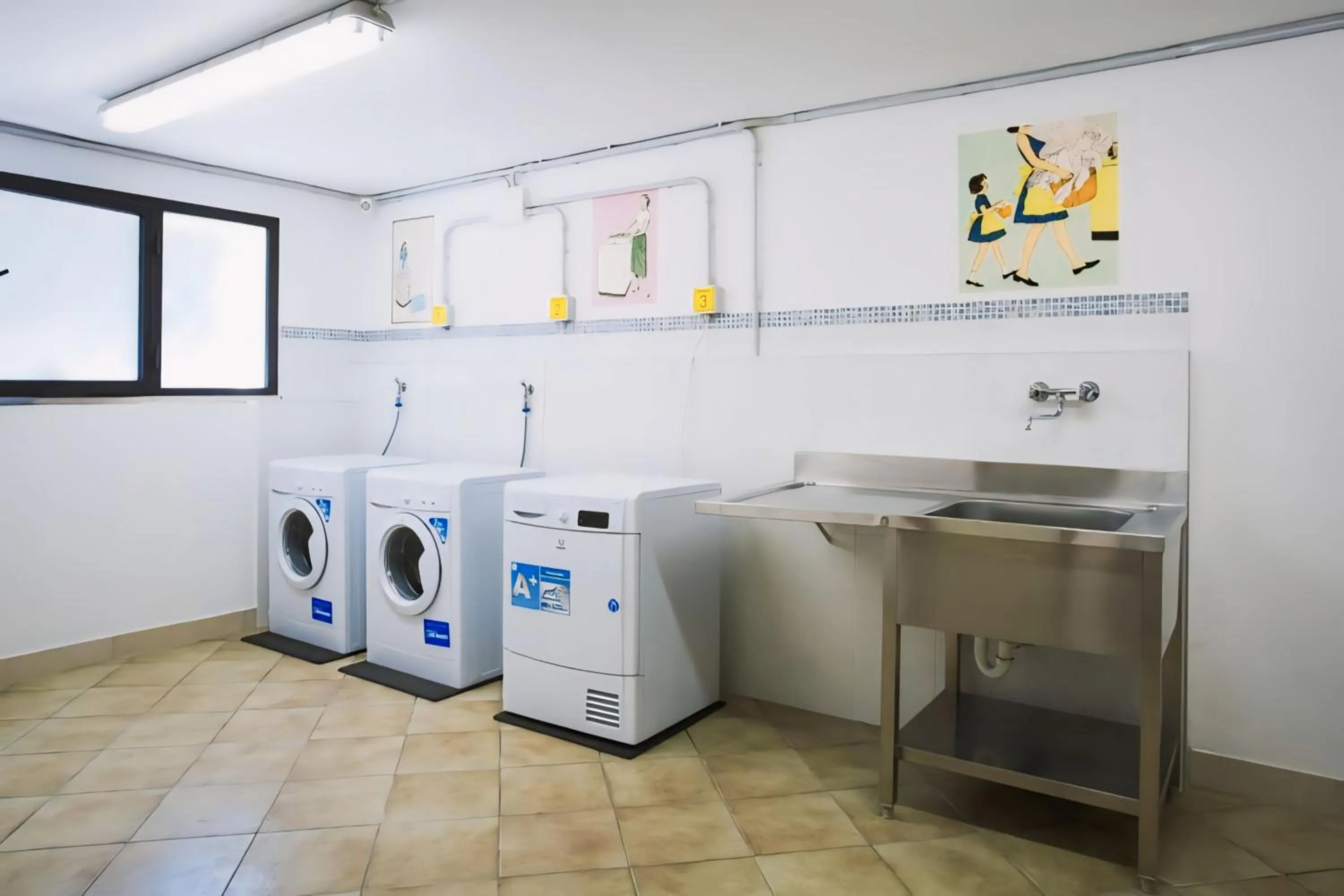 washing machine in Le Rose Residence & Bici House