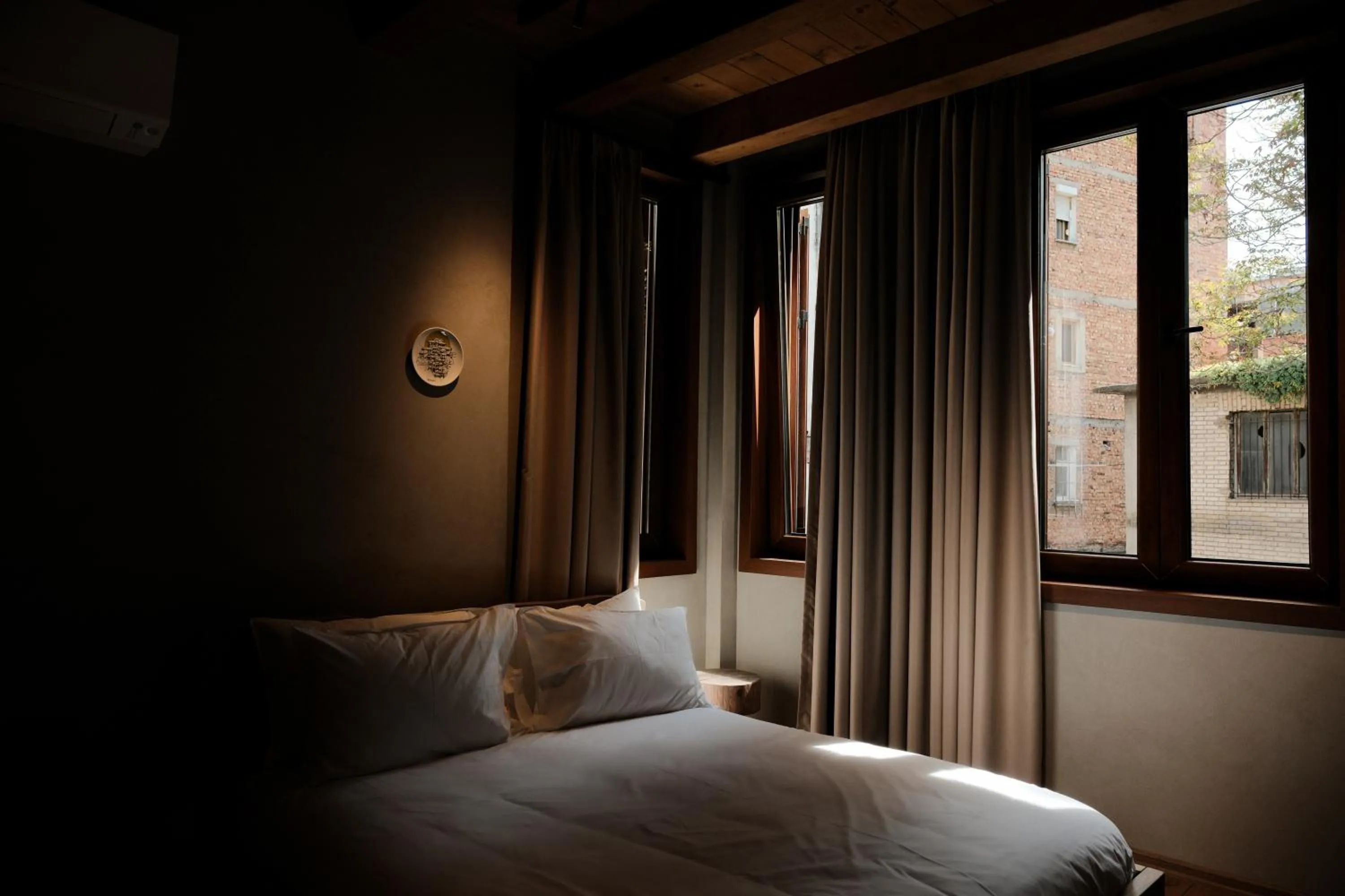 Bed in Faces & Places Boutique Hotel