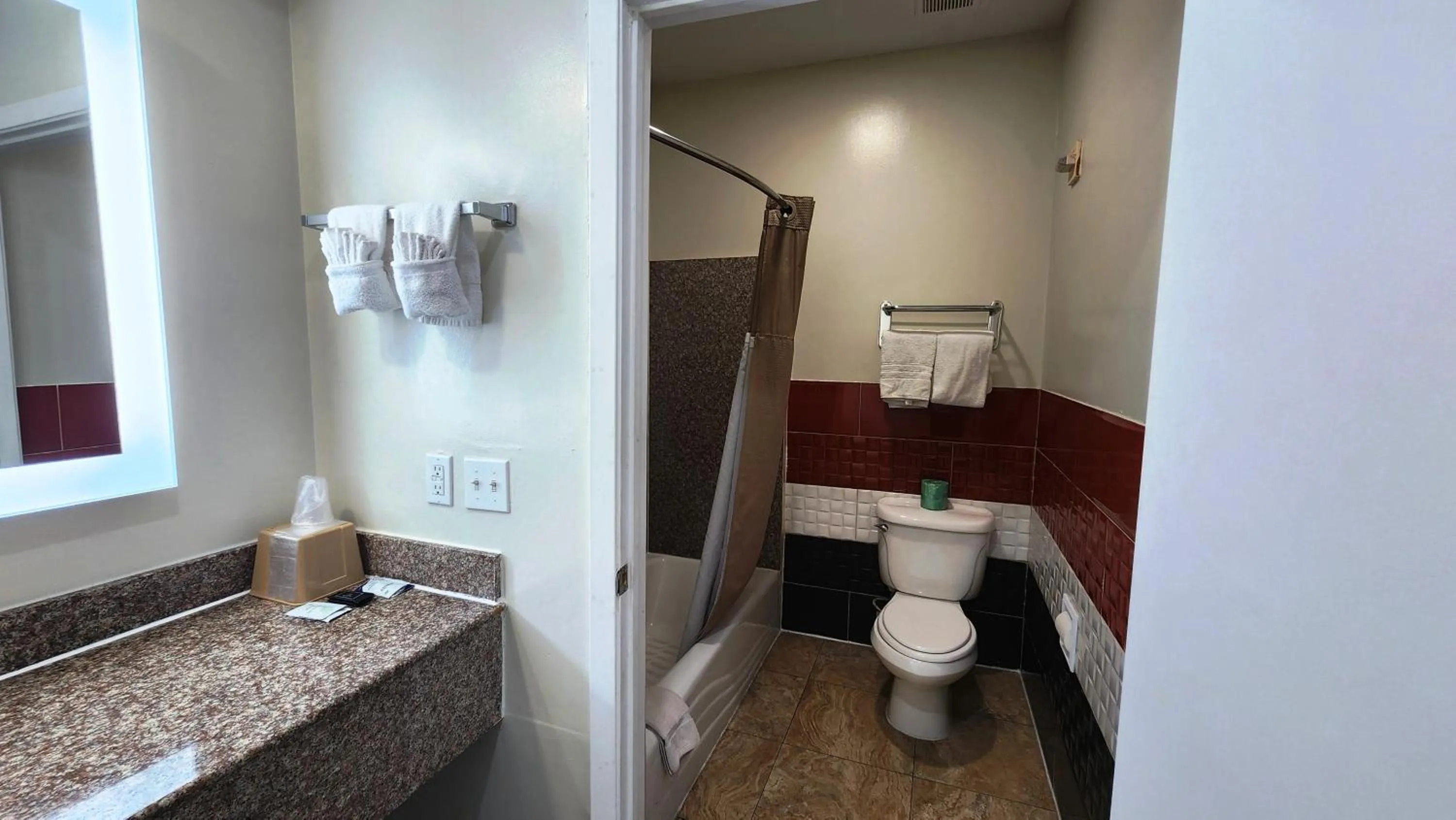 Shower in Scottish Inn & Suites Sam Houston Parkway