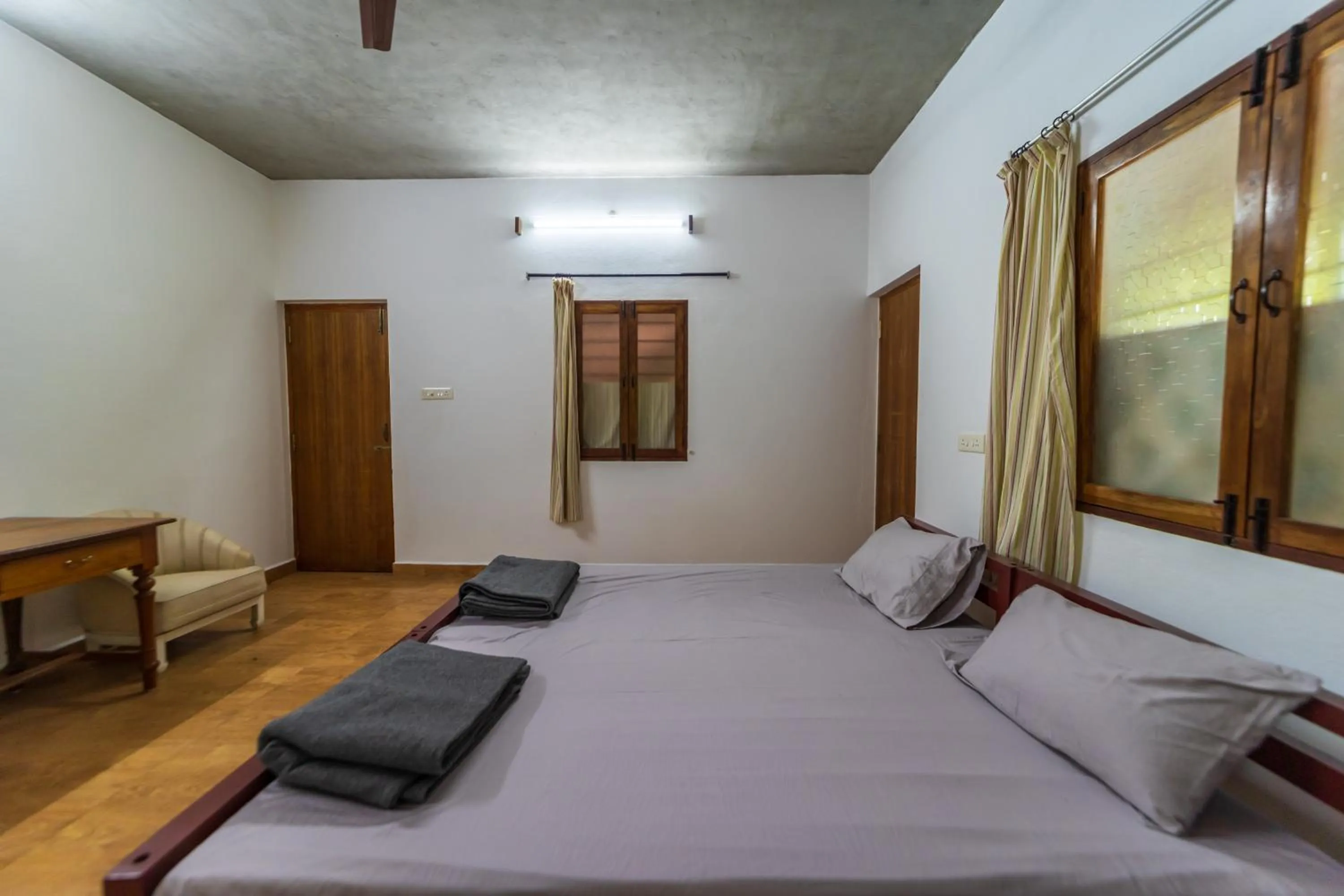 Bed in Aurovidya Retreat