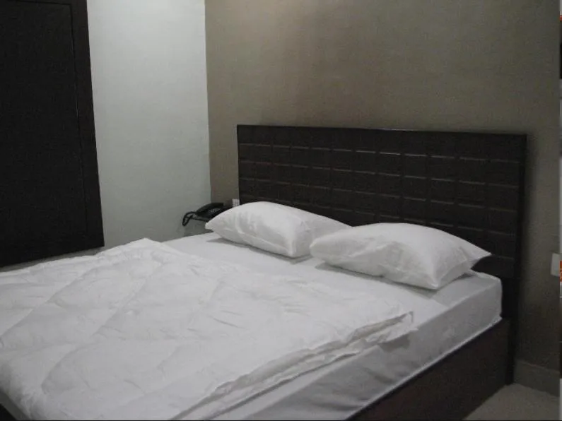 Bed in Hotel Confirm Inn Kota