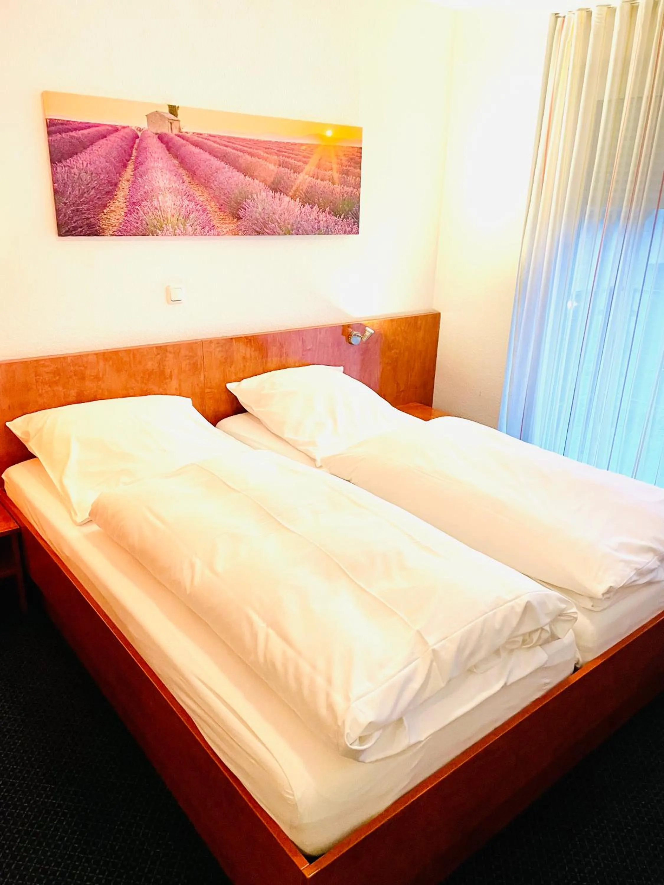 Bed in Hotel Merkenich