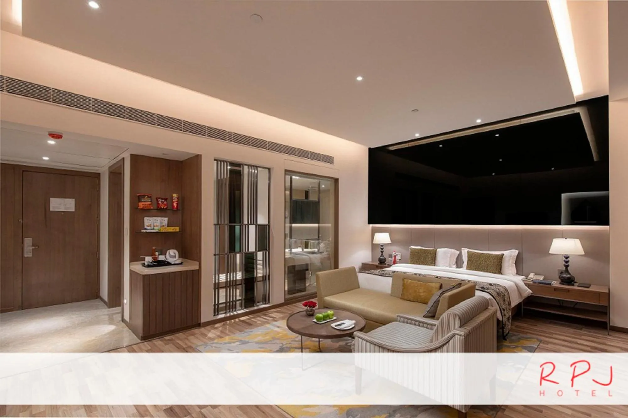 Seating area, Bed in RPJ Hotel Rajkot