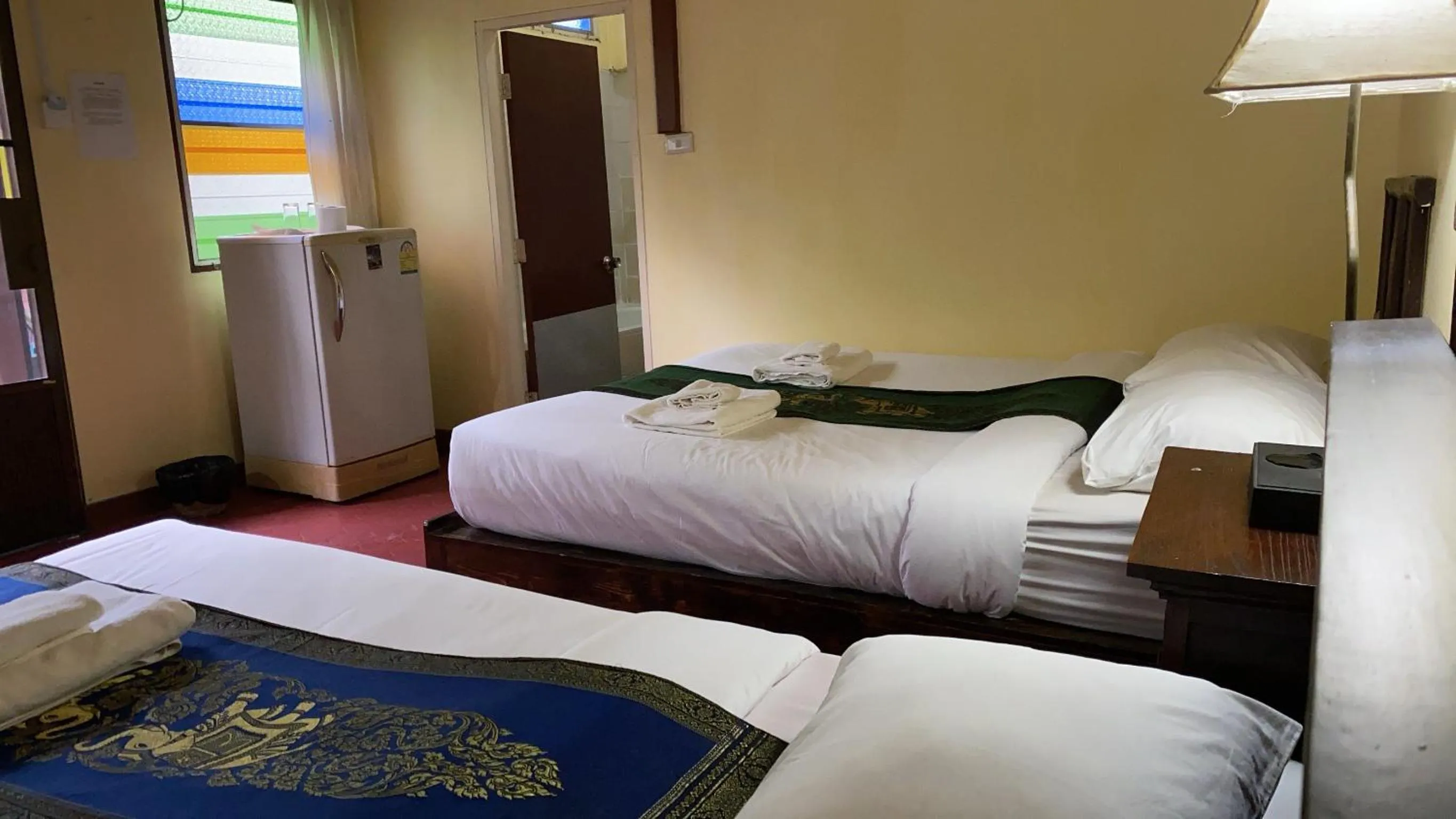 Bed in Golden Triangle Palace Hotel