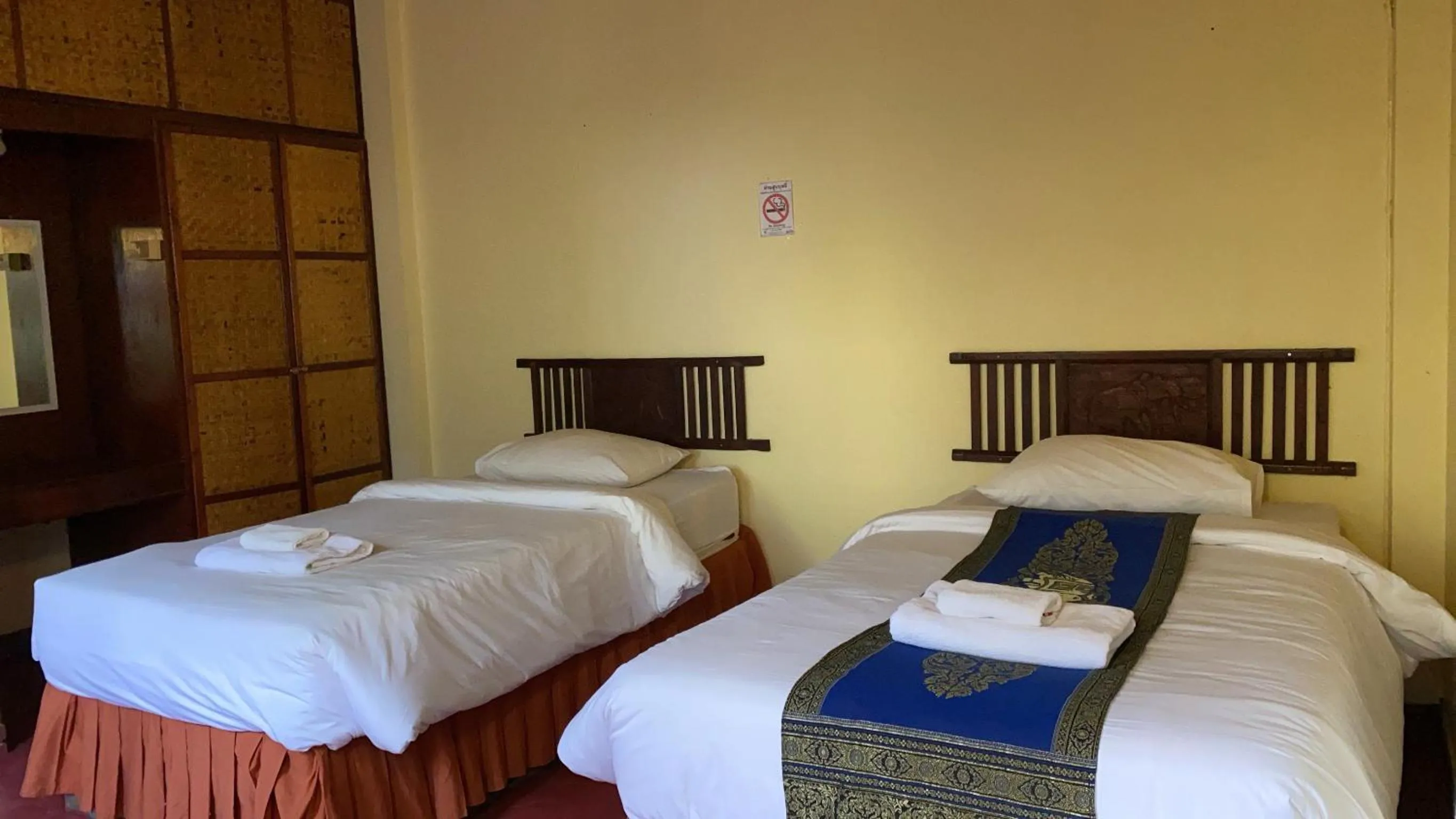 Bed in Golden Triangle Palace Hotel