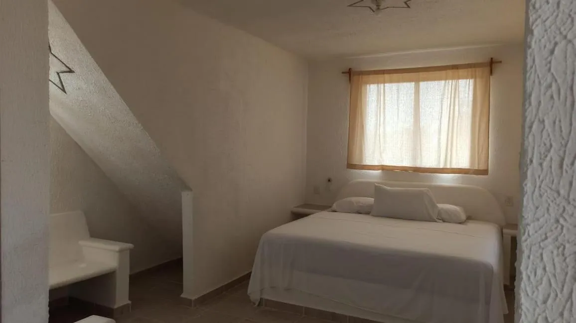 Bed in QUINTA DIAMANTE villas&hotel