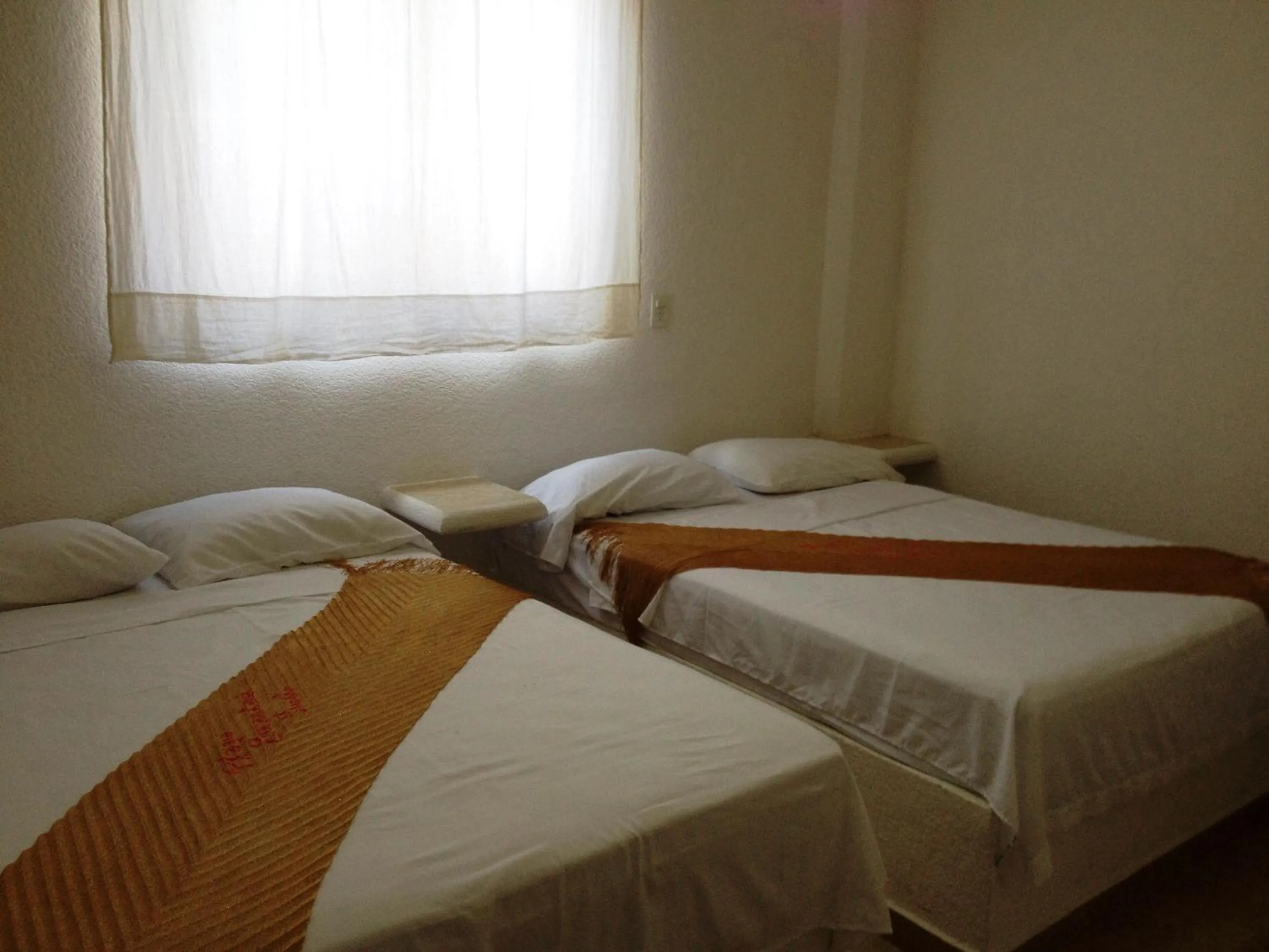 Bed in QUINTA DIAMANTE villas&hotel