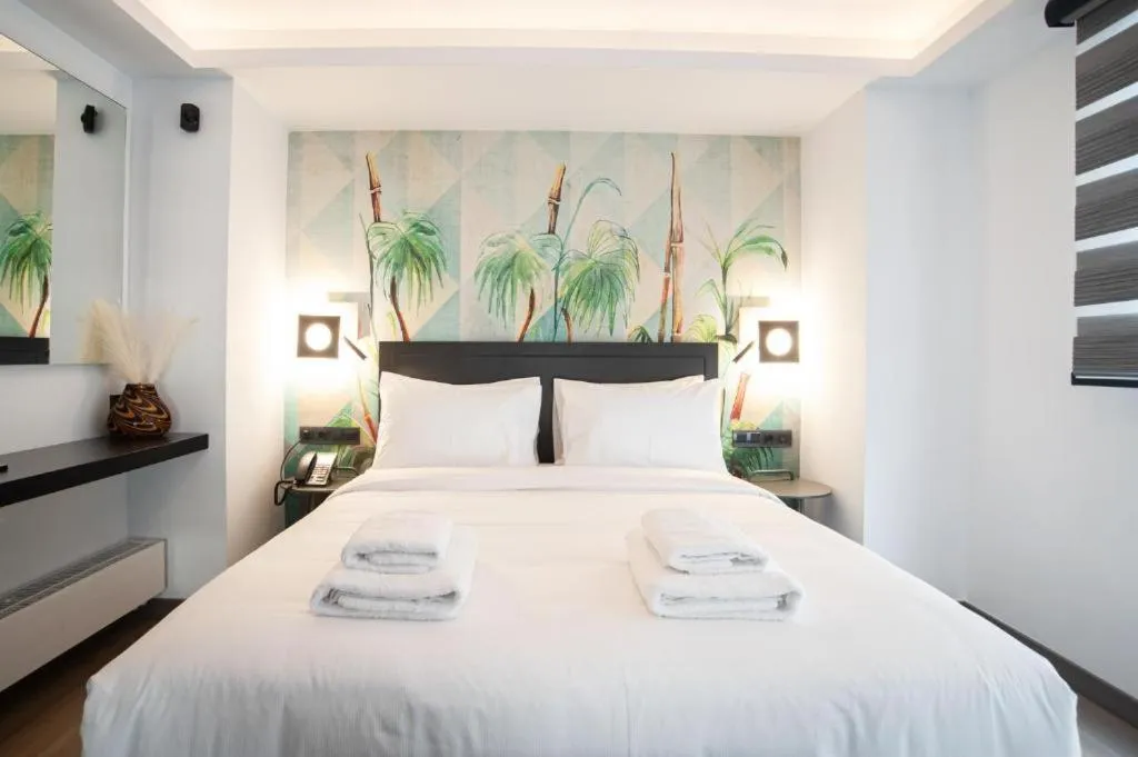 Bed in SIGMA Suites Hotel