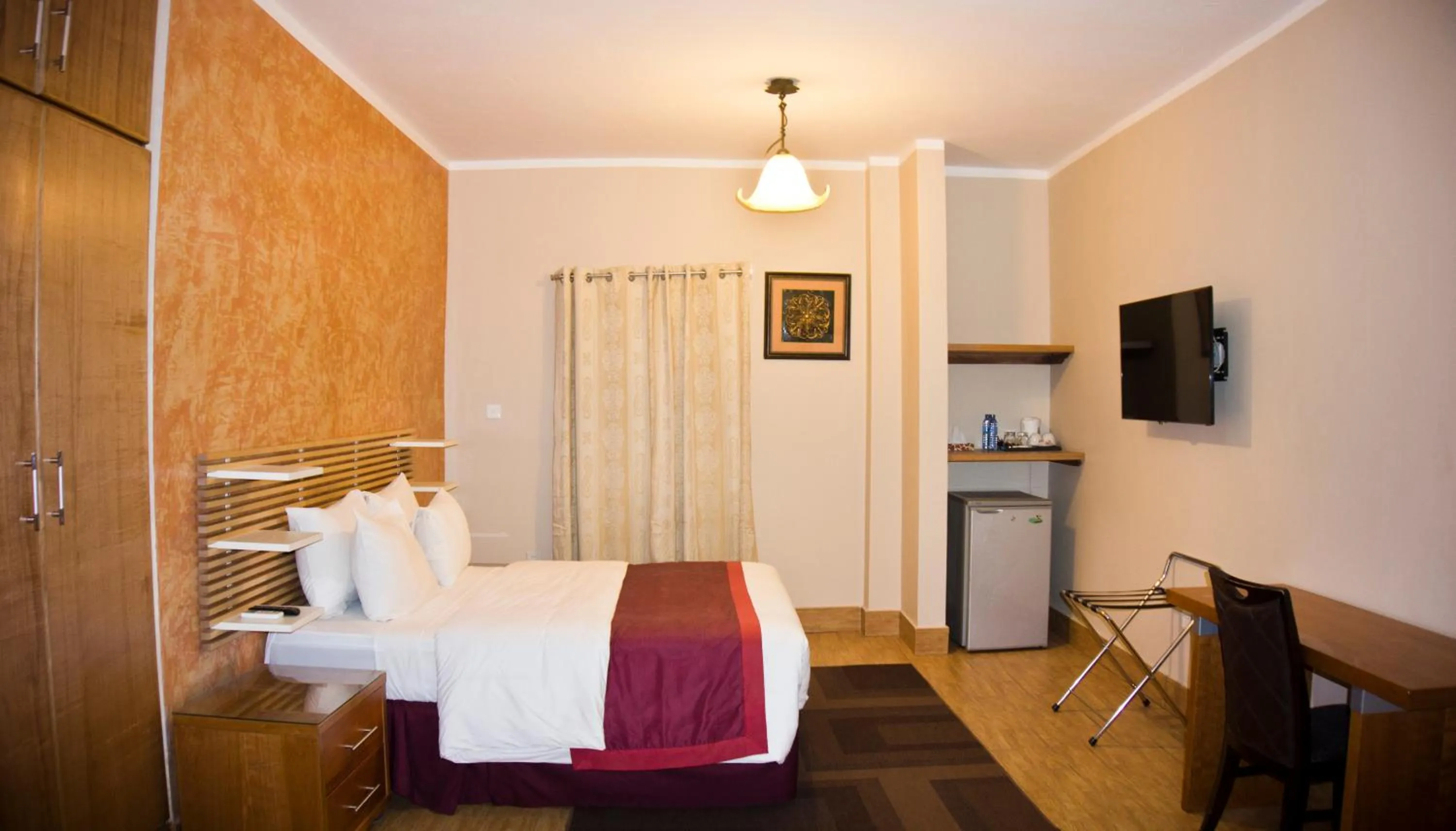 Photo of the whole room, Bed in Tropical Enclave Hotel