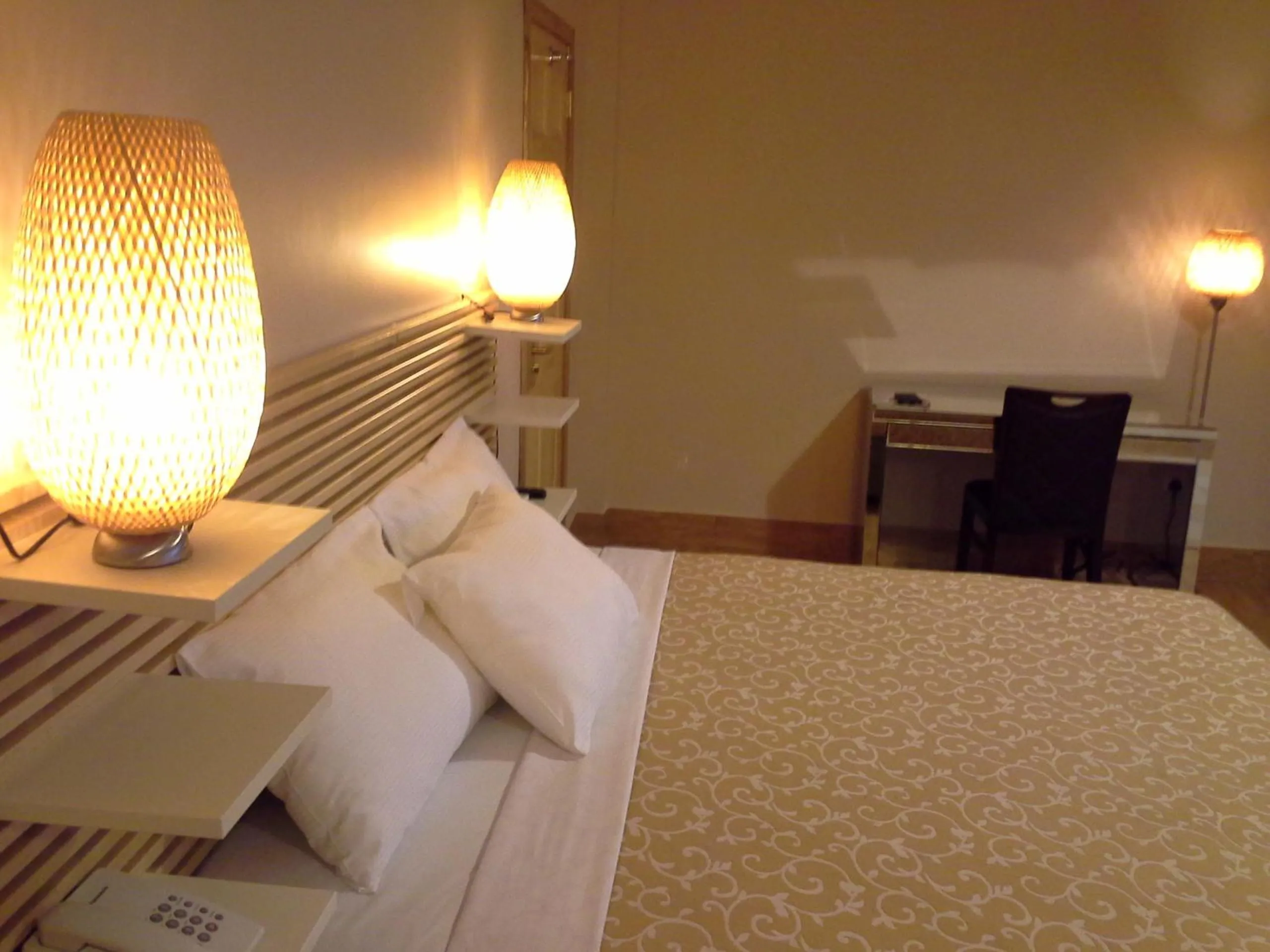 Bed in Tropical Enclave Hotel