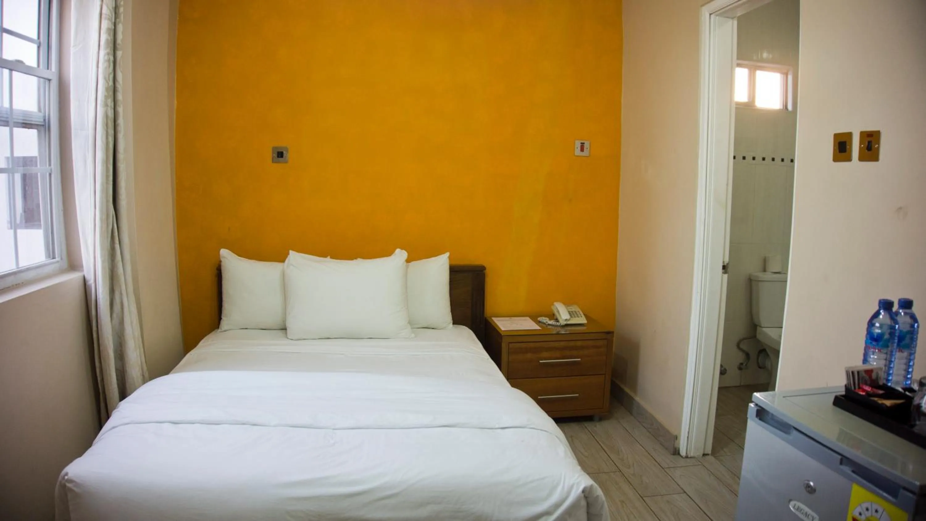 Bedroom, Bed in Tropical Enclave Hotel