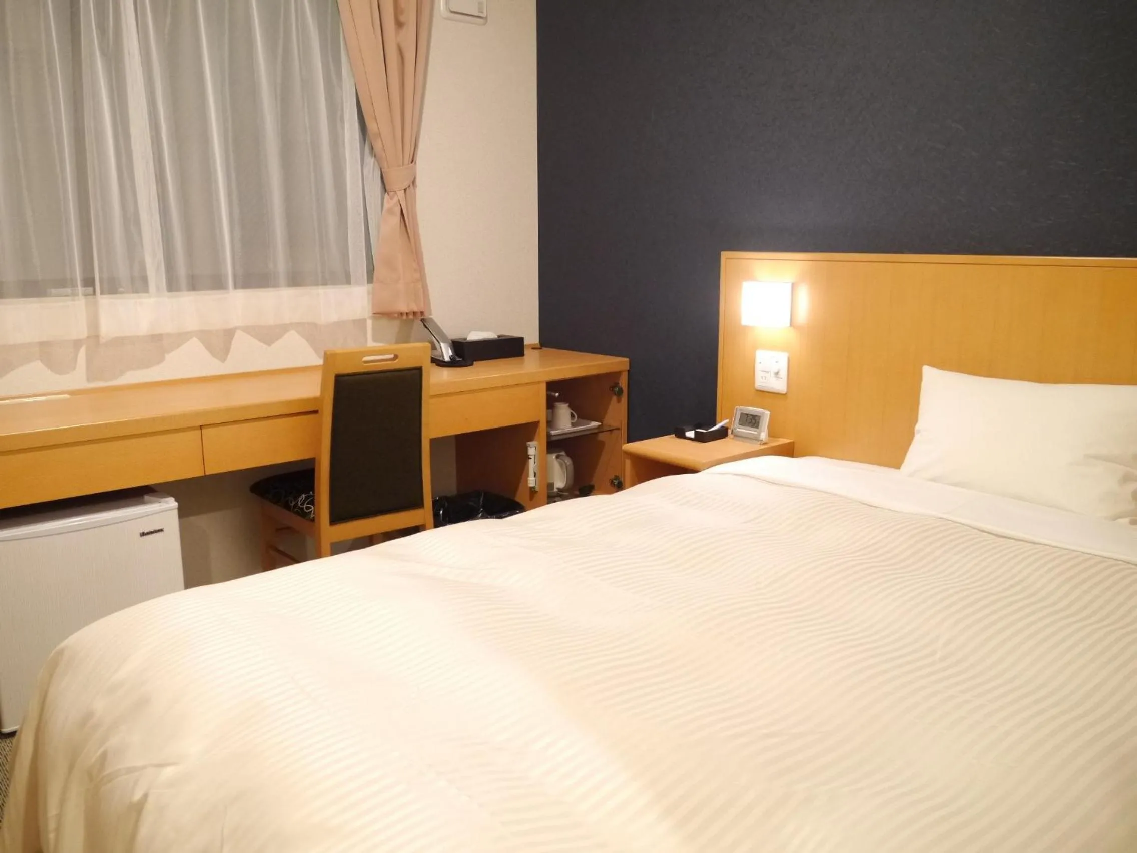 Bed in Fukuchiyama Sun Hotel