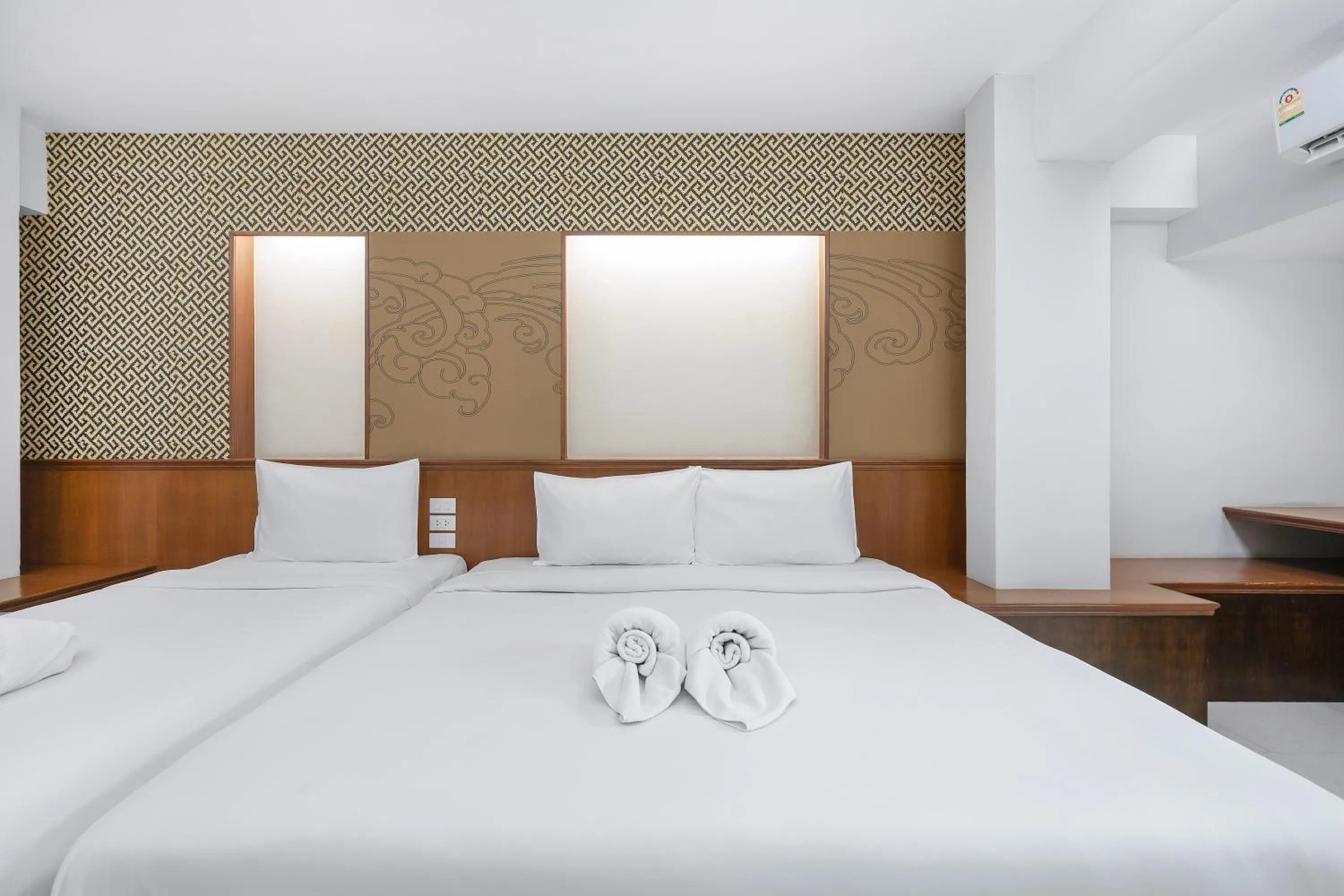 Bed in Cozytel Chiangmai