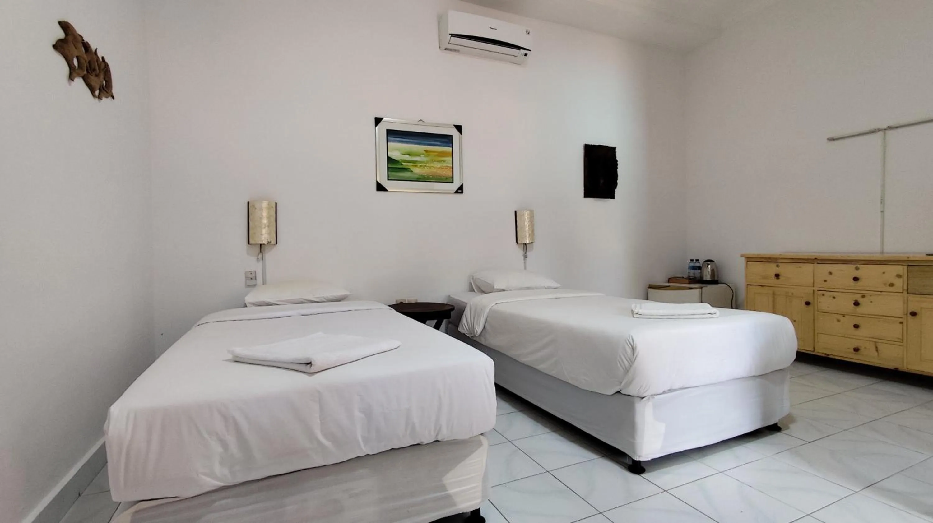 Bed in Keyani Bungalows Lovina