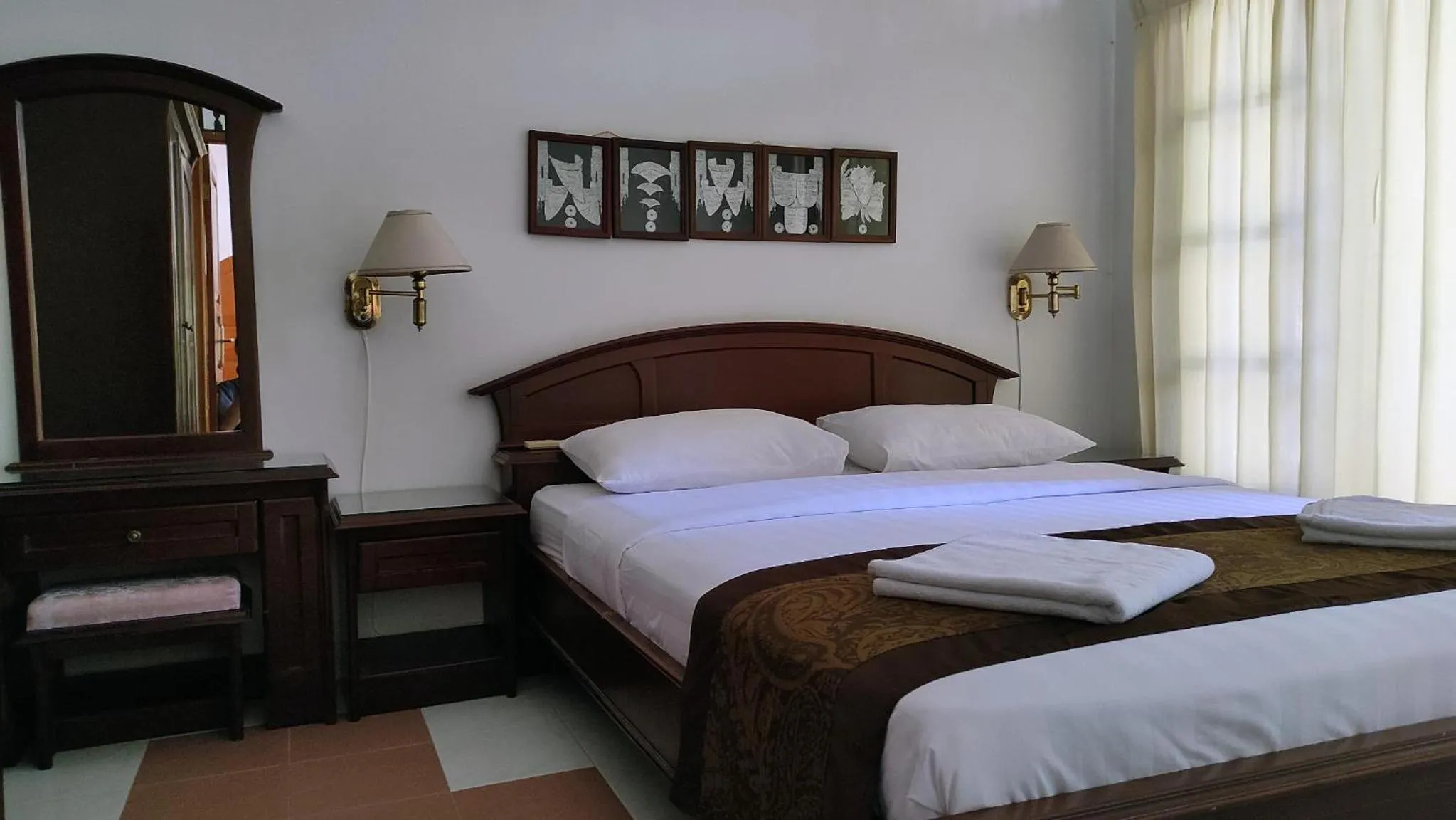 Bed in Keyani Bungalows Lovina