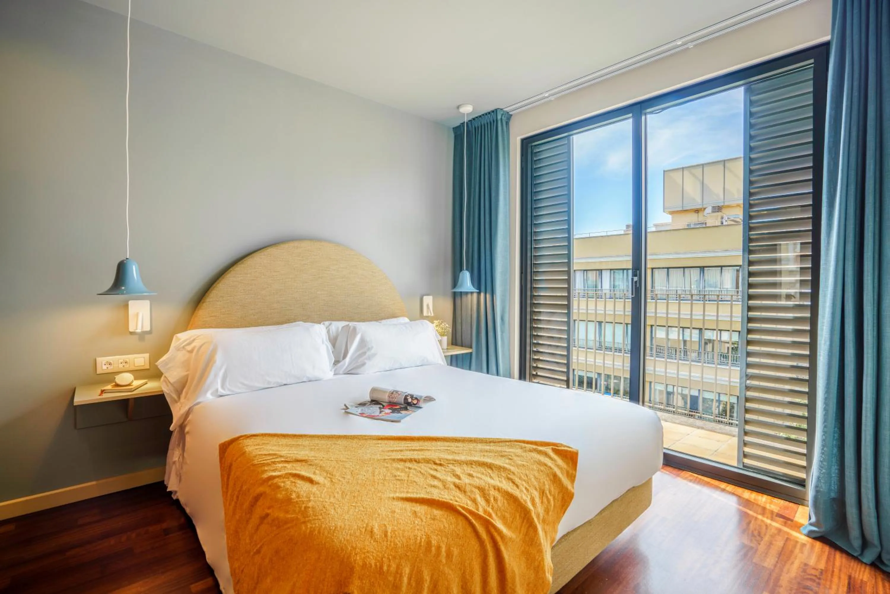 Bed in Aspasios Diagonal Art Apartments