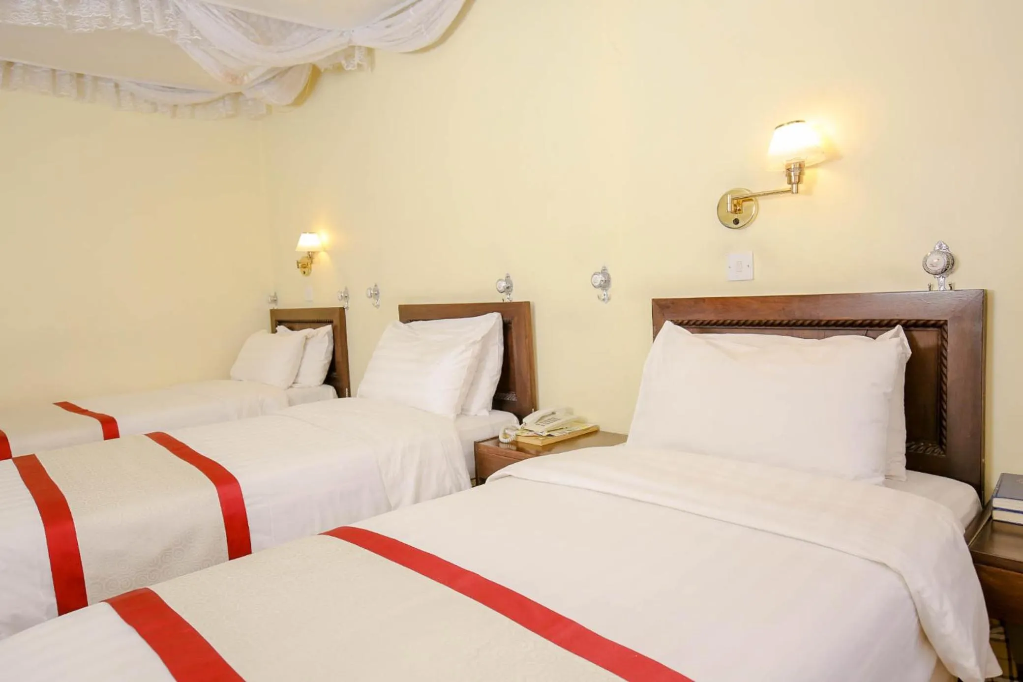 Bed in New Safari Hotel