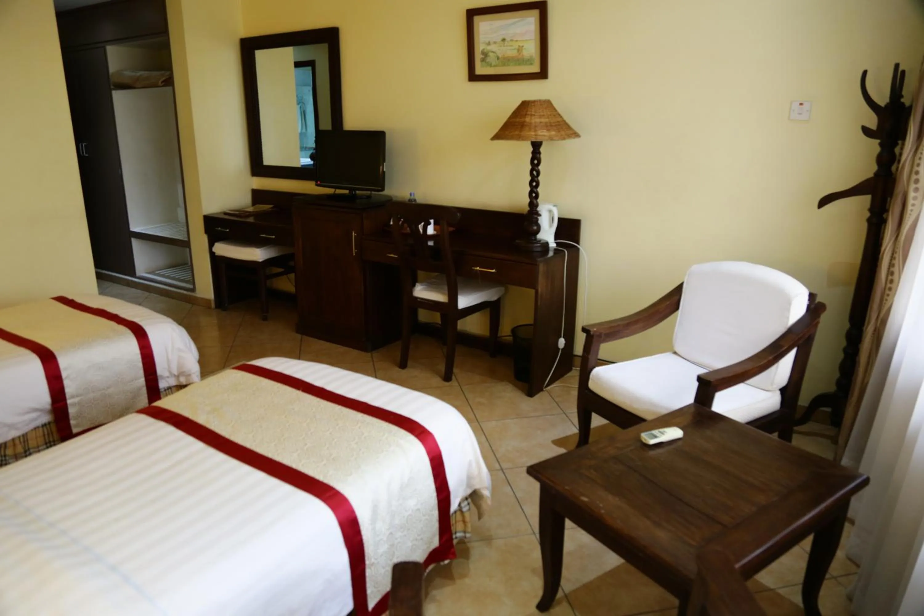 Bed in New Safari Hotel