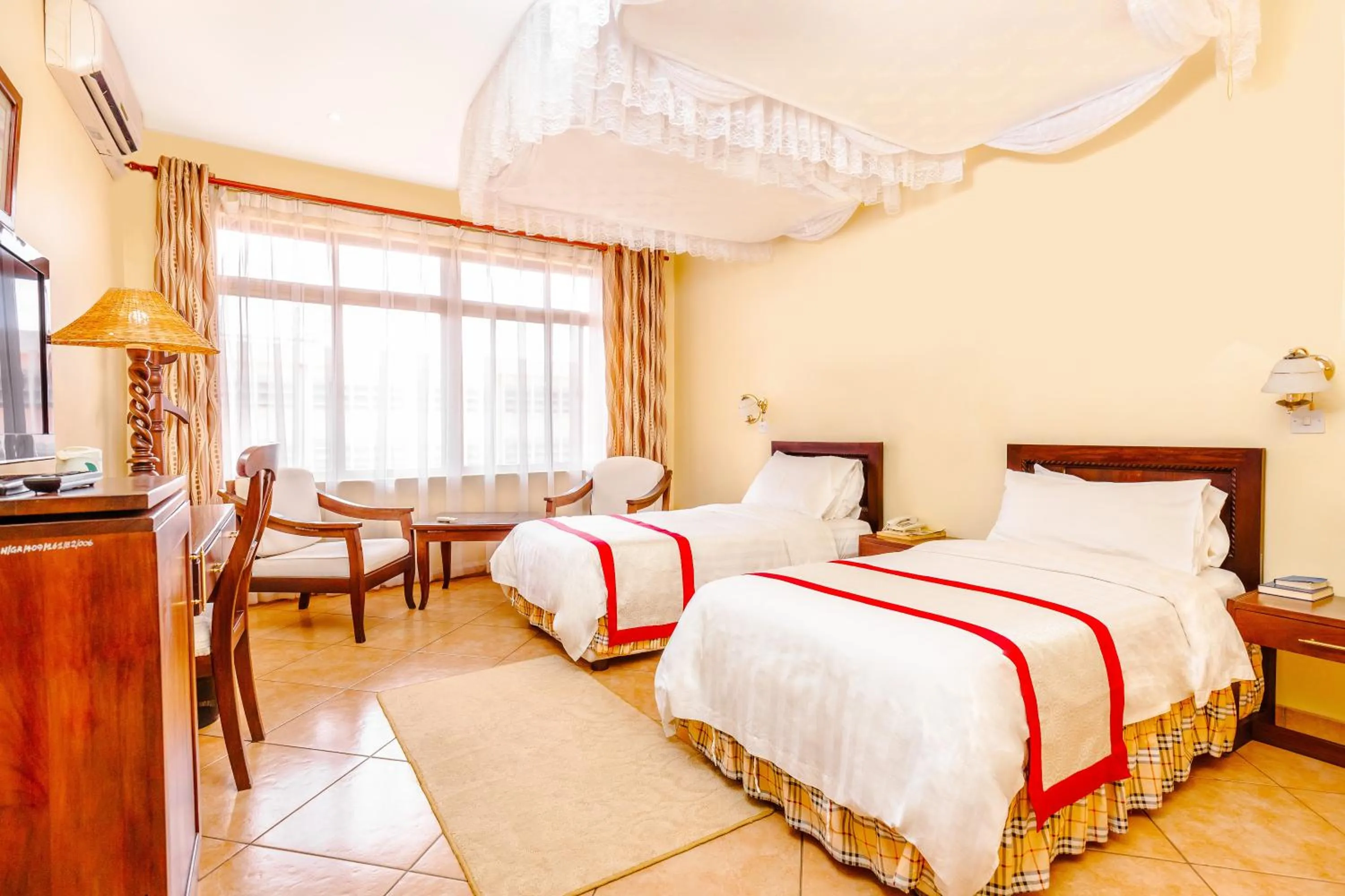 Bed in New Safari Hotel