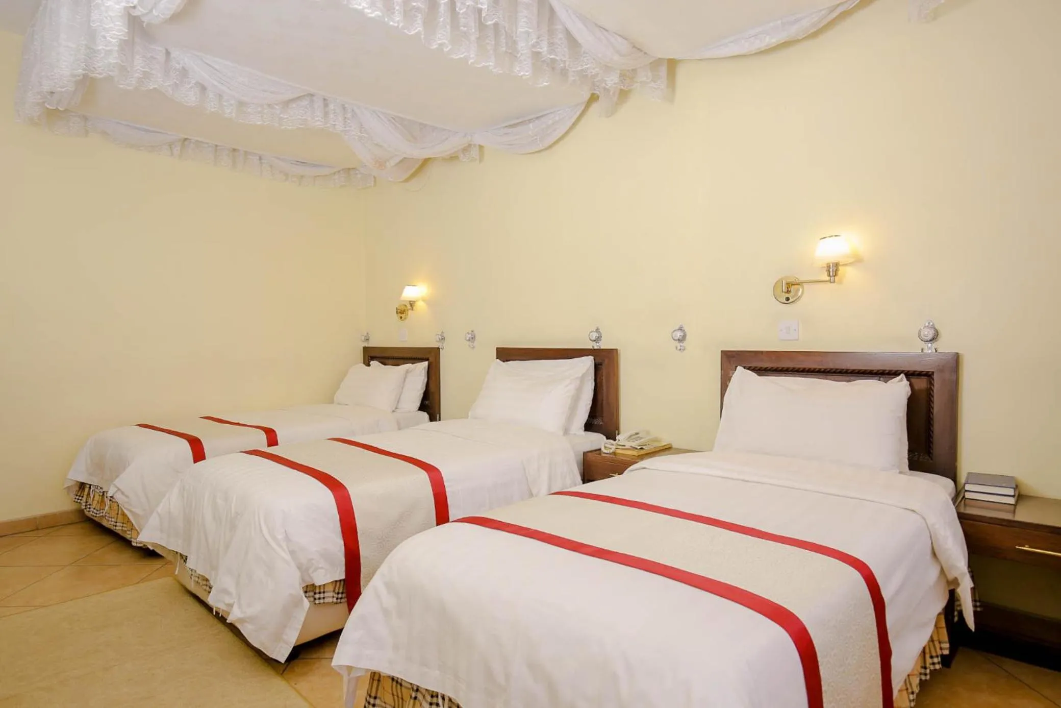 Bed in New Safari Hotel