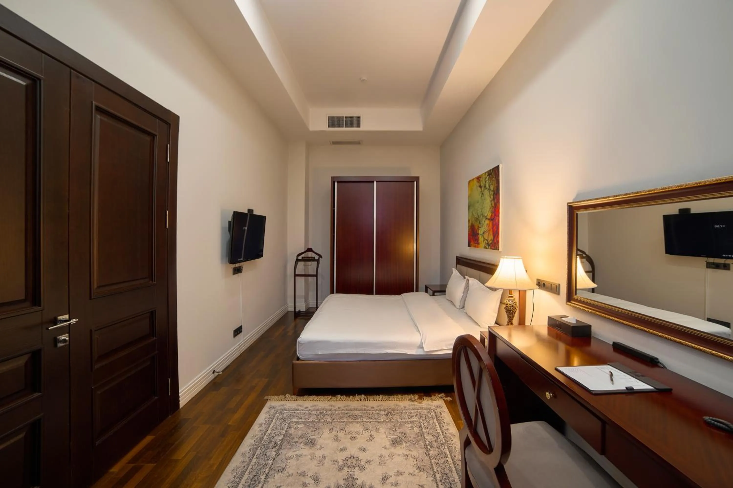 Bed in Ambassador Hotel